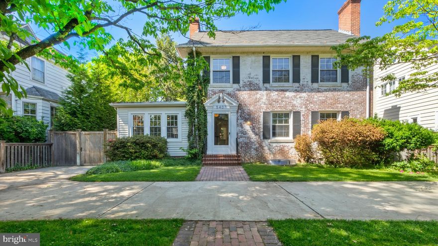 Welcome to 5407 Wilson Lane! This elegant whitewashed brick Colonial boasts six bedrooms, three full baths, and one half-bath, offering an abundance of space and character. A unique opportunity potentially exists for a VA buyer to assume a VA loan at an incredibly low interest rate of 2.375%.

As you walk up the brick pathway and step into the welcoming foyer, you'll be greeted by the warmth of hardwood floors that flow throughout the home. To the right, the spacious living room features built-in shelving and a charming brick fireplace, making it the perfect gathering spot for family and friends. The living room seamlessly connects to the dining room, ideal for entertaining.

The modern kitchen is equipped with stainless steel appliances, including a dual-fuel range, granite countertops, and a stylish backsplash. Adjacent to the kitchen is a convenient powder room and a fantastic mudroom with built-in pantry cabinetry, providing ample storage.

Off the dining room, you'll find a versatile room with French doors that open to a stunning backyard view. This space can serve as a den, office, family room, or more. To the left of the foyer, a cozy room with a second fireplace can function as a primary bedroom with a full en-suite bathroom or as an additional den or family room.

Upstairs, three bright and spacious bedrooms offer plenty of closet space. The shared full bath features floor-to-ceiling marble and high-end fixtures. Custom woodwork, including chair rails, paneling, crown molding, and extensive moldings, adds a touch of elegance throughout the upper level. The finished attic provides additional versatile space, perfect for a bedroom, office, or playroom.

The lower level of the home is a fully self-contained apartment with its own kitchen and laundry facilities, ideal for a home office, in-law suite, or potential rental income.

The large, fenced backyard is perfect for outdoor activities with children, pets, and friends. Located in the sought-after Whitman school cluster, this home is just minutes from downtown Bethesda. Enjoy easy access to shops, restaurants, Metro, the Sunday farmer's market, and all the retail options Bethesda has to offer.

Don't miss this incredible opportunity! Schedule your appointment today to experience the charm and convenience of 5407 Wilson Lane.
