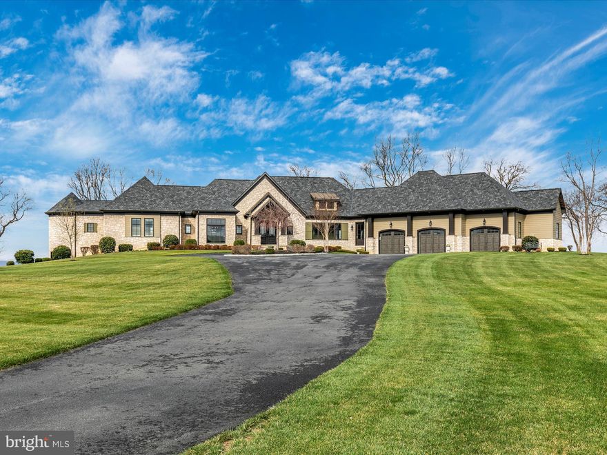 Exquisite Custom Home with Breathtaking Mountain Views in Middletown Valley. Experience luxury living in this stunning custom-built home, nestled on 3.71 acres with some of the most gorgeous mountain views in Middletown Valley that can be seen from most rooms on the main level. Built in 2019, this one-of-a-kind property, that is a custom builder's personal home, boasts 6,912 total square feet of meticulously designed living space. Step inside to an elegant main-level primary suite, complete with a spa-like luxury bathroom, heated bathroom floors and private washer and dryer for ultimate convenience. The coffered ceilings in the family room create a sense of grandeur, while the chef’s dream kitchen is a masterpiece—featuring top-of-the-line appliances (Wolfe and Viking), steam oven, convection oven, and separate ice maker, a huge island and exquisite finishes. Adjacent to the kitchen, the sunroom offers versatility as a home office or tranquil retreat. The lower level features 3 spacious bedrooms, each with access to a full bathroom, a flex room, home gym, and a second washer and dryer for added convenience. Additional highlights include: Expansive 3-car garage with shop, hardwood floors throughout, electric window shades, 2 tankless water heaters, 10 foot ceilings throughout, 3 zone HVAC, rough-in bar option in lower level, firepit, impeccable craftsmanship & high-end finishes throughout, serene, private setting with unbeatable views. Don’t miss this rare opportunity to own a luxury home in the heart of Middletown Valley that looks brand new.  Great location for easy access to major highways. Minutes to the center of Middletown (restaurants, shopping, etc.).