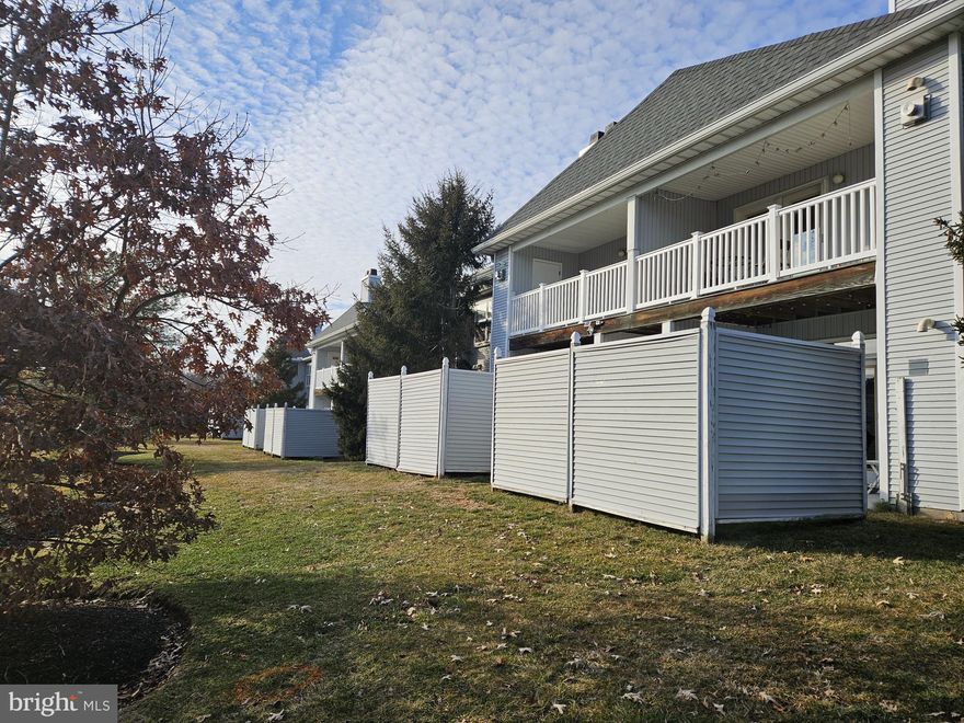 Welcome to Waters Edge! Convenience awaits you in this freshly painted, ground floor 1 Bedroom/1 Bath contemporary condo. Open living space with 9FT. ceilings and luxury vinyl flooring throughout welcome you. The living room with corner woodburning fireplace and mantle plus crown moulding flows into dining room complete with a storage closet. A handy pass-through between the dining room and kitchen will aid when entertaining. Enjoy the southern exposure daylight, which pours through the living room French door and transom topper leading you onto the private patio enclosed by 6FT vinyl siding wall. The kitchen offers gas cooking, plenty of cabinet storage, new refrigerator (March 2026) and new garbage disposal (March 2026). Off the kitchen is the laundry area with washer, dryer, and convenient shelving. A spacious bedroom awaits you with southern exposure, ceiling fan, Tilt Windows, and located near the full bathroom. The full bathroom is fresh and clean, offering tub/shower combination and features a single sink vanity with plentiful storage. 
Fitness Center and Outdoor pool are a short walk away, as is the Public Bus Stop. Newark Train Station is less than 4 mites away for easing your commute. Dining, shopping, groceries are nearby, as are major highway routes I-95 and Rt. 40. 
Convenience abounds! HVAC was replaced (December 2025) and the 55 Gallon water heater was replaced (late 2024).  
Schedule your private showing to your new home today!! Ready, set, BUY!!