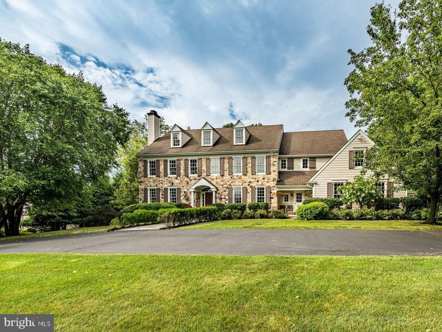 Welcome to 33 Greenbriar Circle, a meticulously maintained original model home boasting unlimited upgrades throughout. This 5-bedroom, 6-bathroom residence with 4 fireplaces is nestled in the charming Brooklands development in Charlestown township, offering over 7000 sq ft including the lower level.

Upon entry, a grand front-to-back open foyer adorned with custom wainscoting sets the tone. The formal living room features a gas fireplace, while the bright dining room offers access to the butler's pantry, ideal for entertaining. The expansive gourmet chef's kitchen showcases Quartzite countertops, hi-hat lighting, and a large island, complemented by commercial-grade stainless steel appliances. Adjacent is the vaulted coffered ceiling family room with another gas fireplace, leading to a spacious breakfast room flooded with natural light and patio access.

The office/library impresses with coffered ceilings and built-in shelving, accompanied by two powder rooms and a substantial mudroom with cubbies on the main level.

Upstairs, discover 5 bedrooms, 3 full bathrooms, a laundry room, and ample storage. The primary suite rivals a hotel with its gas fireplace, coffered ceilings, sitting/dressing area, and luxurious bathroom featuring Quartzite countertops, dual sinks, a water closet, walk-in shower, and tub. Four additional bedrooms and 2 full bathrooms complete this level.

The lower level offers a full entertainment oasis with a family room with gas fireplace, theater room, pub with kitchen, game room, exercise room, full bathroom, and music/flex room. Outside, a private resort-style pool with a soothing waterfall in a two-tier design invites relaxation and enjoyment.

Don’t miss the chance to own this luxurious retreat, perfect for both relaxation and entertainment in a private setting.