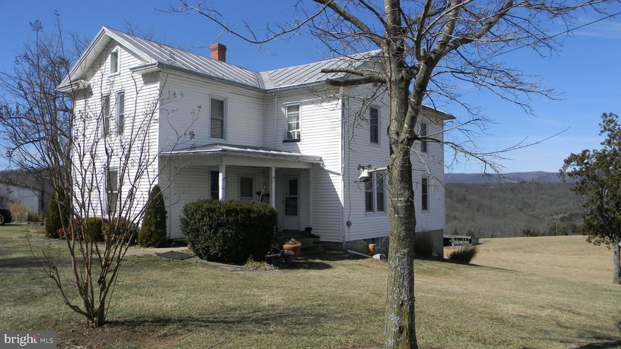 Remarkable Views from this tastefully Remodeled Farmhouse on 34+/- acres with 3 bedrooms and 2 full baths.  Home was built  from lumber harvested from farm in 1892 and in Oak and Heart Pine.  Owner has professionally remodeled Home to include new Kitchen, bathrooms and beautiful Woodwork.  One bedroom on main level and 2-3 other bedrooms upstairs.  Oil forced air heat with nice woodstove in den off kitchen.  Tilt-in Easy clean Windows throughout..  New flooring and lots of custom wood in the home makes for "just Like Home" feeling.  Large family room for family gatherings.  Now lets add 34.4+/- acres of rolling land with spring fed pond and the fantastic North Mountain Views of Corkers Knob and North Mountain.  Several Springs on property that feed Pond and eventually Mill Creek.  Property has Large Bank Barn with stables for horses  and/or Cattle.  Property has 2 story washhouse with meat house for butchering..  Large Shop for your tools and repairing with nice Woodstove.  Riding arena for your horses and plenty of room to ride.  Several other outbuildings for machinery storage just add to the value.  Farm was used to train horses and raise cattle.  This is truly a once in a Lifetime chance to own a Farm with virtually everything a family needs from farming, gardening, hunting, riding and enjoying  the Outdoors.  The Million Dollar Views just add to delight of owning this Farm..  Take a look, You will want this one.......