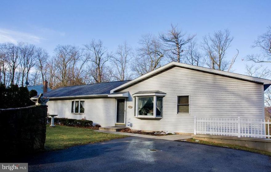 Welcome to 1336 Piketown Road—an amazing 3-bedroom, 3-bath home nestled in a peaceful country setting with beautiful, wooded privacy behind the property and a scenic mountain view. Enjoy convenient main floor living with two bedrooms upstairs, while the third bedroom and a full bath are located on the spacious lower level. Relax and unwind on the large deck overlooking nearly 2 acres of tranquil surroundings. The generous Owner’s Suite features a walk-in closet, full bath, and direct deck access. The Great Room offers vaulted ceilings and an open floor plan that fills the home with light and openness. This property includes both an attached 2-car garage and a detached 1-car garage equipped with a wood-burning stove. A separate workshop/shed—with electric—was previously used for ducks and chickens, offering flexible options for hobbies, storage, or small animals. Additional highlights include efficient propane heat installed in 2022, two separate driveways providing parking for 6–10+ vehicles, and a charming stone wall welcoming you at the front of the property.This home is full of potential and ready for your personal touches. Selling As-Is.