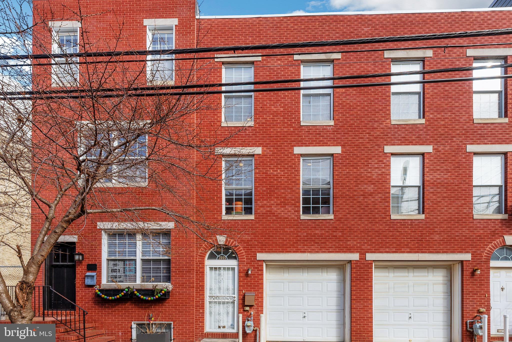 Come see this lovely three-bedroom, three-bath townhome in the Fairmount/Francisville neighborhood. Gorgeous hardwood flooring, custom window treatments, freshly painted and ready for its new owner. Entry level with garage, foyer, full bath and french doors leading to a bedroom/den - great for in-law quarters or guests.  Huge unfinished basement, ample storage space.

Main level offers a spacious open floor plan between the kitchen, dining and living areas. Kitchen features granite-slab countertops, stainless-steel appliances, and abundance of cabinetry for storage. Dining area with gas fireplace connects the kitchen to the main living area. Large windows in living room let in lots of sunshine. 

Upper level has stackable washer/dryer, conveniently located to two bedrooms. The main bedroom features a private ensuite bath with whirlpool tub. Second upstairs bedroom features a large walk-in closet with a window for natural light. Parking isn't a problem with a 1-car garage AND additional space to park another 2 cars in the back! Don't need more parking? Create your own personal outdoor living space! 

Stucco on the rear of the home recently replaced with vinyl siding and house has a new roof (2 yrs. ago and certified). Located in the Bache Martin School catchment with easy access to public transportation. Short walk to the Philadelphia Museum of Art, the Free Library and other Parkway attractions and events. Close to local amenities like coffee shops, Whole Foods, a community garden, and restaurants!