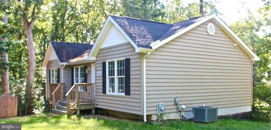 Tucked away treasure!  This home shines like new and is in a peacefully tree lined setting.  The main level offers updated flooring and paint. 3 good sized bedrooms. The lower level offers a walk out and offers a large living space that could be finished or for great storage. Come take a look and make this home yours for less than rent!