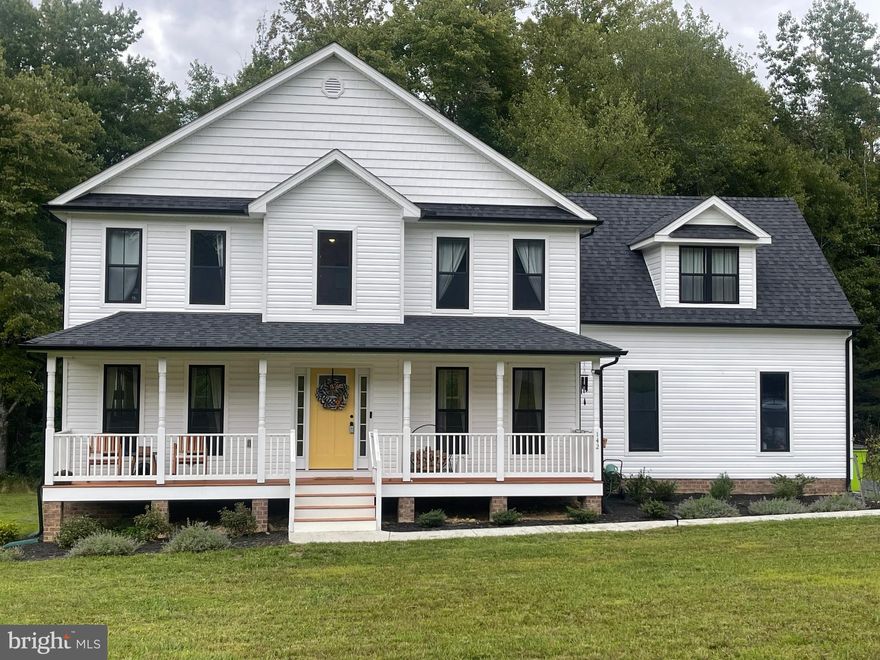 Looking for new construction?  Why wait?  This home was just built in 2022 with UPGRADES GALORE!  Craftsman front door, Insulated sideload garage, Upgraded kitchen layout with island, Granite counters, Oak staircase with iron banisters, Upgraded cabinets, LED lighting in all bedrooms, Extra windows in the Great Room, Box bay window, and Stainless steel appliances! Beautiful 2+acre lot in a peaceful, serene setting.  This Liberty built home is The Ross floorplan with the popular Elevation M option.  This gives you the FULL front porch and the shingle shake upper peak.  Upgraded black framed windows and black gutters provide that Magnolia Home Farmhouse feel!  The welcoming floorplan is open, spacious and perfect for entertaining. Upstairs features 4 spacious bedrooms and 2 full baths.  The primary bedroom has an attached bath featuring a large garden tub, separate shower and double vanity.  Plenty of room for all of your clothing in the large walk-in closet.  The attic is accessed by pull down stairs, and is partially floored providing for extra storage.  Outside, you will enjoy a large rear deck, firepit, firewood storage shed, raised bed garden, and a chicken coop with a rooster and laying hens.  The property has 3 apple trees that should produce fruit next year along with 2 blueberry bushes.  The only thing you may want here are goats and perhaps a horse for your very own Farmette!