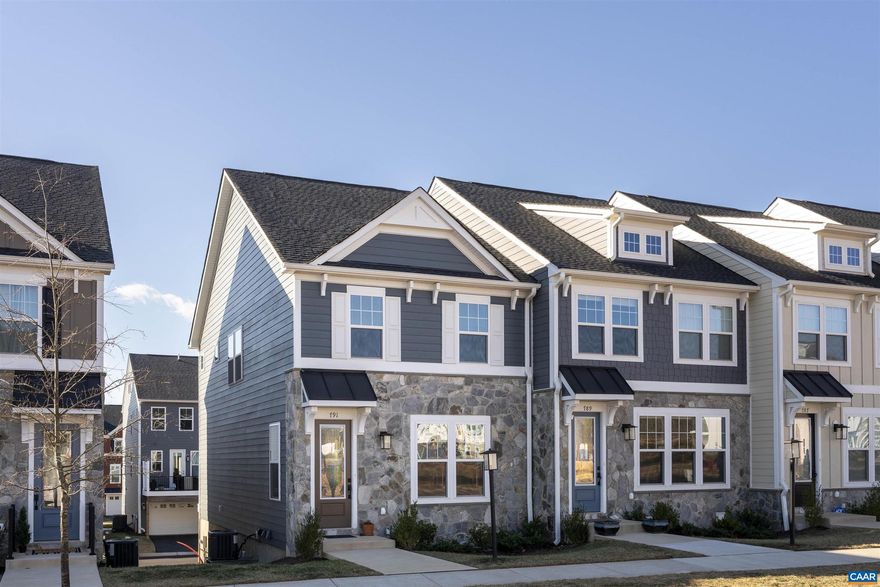 Pristine end-unit + $5,000 CLOSING CREDIT TO PURCHASERS with acceptable offer. Better than new valuable upgrades already in place: EV charger ready, custom window coverings, upgraded light fixtures, and additional built-in storage. No need to wait for new construction. Main level showcases open-concept living with a bright white kitchen, Quartz countertops, upgraded pendants, and flowing layout connecting kitchen, living, and dining spaces. Lower level features finished family room and half bath. Upper level offers three bedrooms including a generous primary suite with extra windows and en suite bath with glass shower. Two-car garage and rear deck provide convenience and outdoor living space. Ideally situated near downtown Crozet, schools, and Crozet Park for easy access to dining, shopping, and recreation. Enjoy the walkable neighborhood with community firepit and worry-free HOA that covers lawn maintenance and trash removal. Move-in ready at an exceptional value.,Quartz Counter,White Cabinets