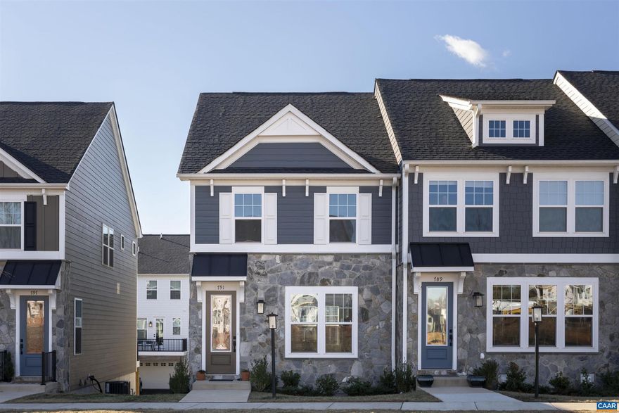 Pristine, 1 yr old, end unit with valuable upgrades already in place: EV charger ready, custom window coverings, upgraded light fixtures, and additional built-in storage. Main level showcases open-concept living with a bright white kitchen, Quartz countertops, upgraded pendants, and flowing layout connecting kitchen, living, and dining spaces. Lower level features finished family room and half bath. Upper level offers three bedrooms including a generous primary suite with extra windows and en suite bath with glass shower. Two-car garage and rear deck provide convenience and outdoor living space. Ideally situated near downtown Crozet, schools, and Crozet Park for easy access to dining, shopping, and recreation. Enjoy the walkable neighborhood with community firepit and worry-free HOA that covers lawn maintenance and trash removal. Move-in ready at an exceptional value.,Quartz Counter,White Cabinets