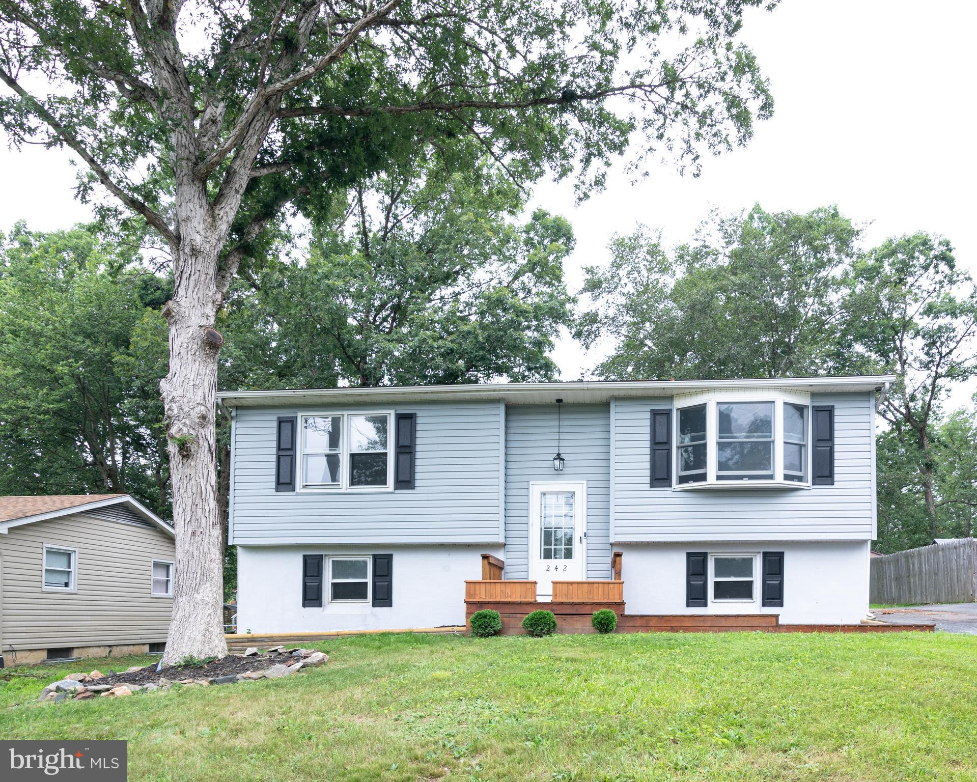 Welcome to 242 Irishtown Rd. This home has pride of ownership. Come take a look at this 5 bedroom 1 bath home in North East. You will find new flooring and carpet throughout, fresh paint, and newly updated bathroom, and kitchen. The eat-in kitchen has lots of cabinets for storage, a coffee bar, and a wine fridge. Upstairs you have a large living room, your Primary bedroom, and 2nd bedroom. You also have a large deck off the kitchen for entertaining or just relaxing. The lower level offers 3 additional bedrooms, laundry room with belco doors for access to the backyard, and a foyer/sitting area. In the foyer the bench opens up and there is rough in plumbing there if you wanted to add a second bathroom in that area. You have a very nice side yard with a shed outback. Don't miss out on this home. Schedule your appointment today!!