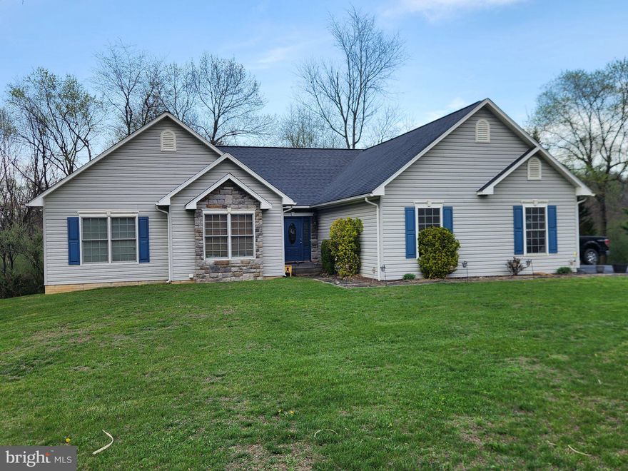 Spacious Ranch Home that is perfect for your family. Location is everything and this one has it all, Near 522, Near the Cacapon State Park, Near the Ball Fields and Soccer Fields. Private black top lane and driveway!  Easy commute to Winchester VA, and Berkeley Springs is just 6 miles away. Over 3,600 ft of finished living area, 3 bedrooms, 3 full baths. Open flowing layout on the main floor that includes, kitchen with island bar, huge living room, owners suite with luxurious jetted tub layout, two additional nicely sized  bedrooms, laundry on the main level. The lower level has a well designed bar area and an enormous rec / family room, a full bath and additional storage. The attached two car garage provides easy access and all weather protection. Fiber internet for work at home and family streaming! The large yard is private and has many possibilities for your family. Come and check out this home, you'll be glad you did!