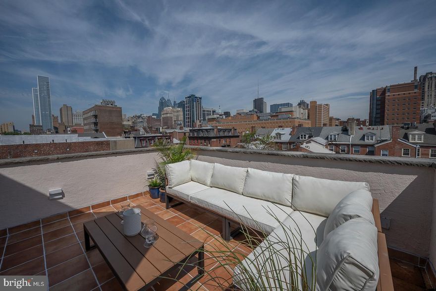 Urban elegance defines this stunning 3-story, 2 bedroom & den /3 bath condominium home with 2 -Car Parking nestled in a 4 unit historic townhouse on one of the most beautiful blocks in Center City.  "Welcome to 929 Clinton St. residence #4", spanning 3 manageable floors of 2500  square feet.   Marvel at this creatively designed  townhouse style condo with a PRIVATE ELEVATOR,  TWO CAR PARKING and ROOF DECK.  Highlights include:  a spacious well appointed gourmet  kitchen, living room with fireplace and dining area with access to your roof deck with magnificent city views.  Also, a full floor with a sunny study,  a guest bedroom and bath.   The master bedroom suite is on a level of its own, with an oversized  walk-in shower, two separate areas with  marble wash basins and commodes.  Other features include;  Brazilian Cherry floors, detailed lighting, exceptional closet and storage space, washer/dryer, zoned  heating and Central A /C. The property has a fully sprinkled fire alarm system, a storage locker in the basement and is a smoke free building. This exceptional home is located within a short walk to public transportation and to all the wonderful shops and the many  fine restaurants of Washington Square West and all of Center City.