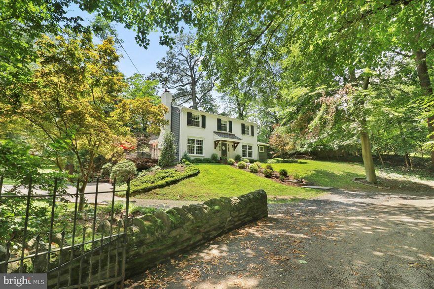 Tucked away on a quiet, private lane, this beautifully updated mid-century home offers the perfect blend of tranquility and convenience. Just a short stroll to the "Top of the Hill" and the Wissahickon Trails, this 4-bedroom, 3.5-bath home sits on .77 acres of serene land—your own peaceful escape from the hustle and bustle, while still being close to all the vibrant offerings of Chestnut Hill.  As you approach the home, a charming bluestone walkway guides you to the sun-filled center hall. Step inside and be greeted by natural light and views that lead you into the spacious living room, complete with a wood-burning fireplace and French doors opening to a large cedar deck. The deck overlooks lush, mature landscaping and tranquil gardens, creating the perfect setting for outdoor relaxation.  Just off the living room, a lovely parlor area connects to a stone and brick patio to the many quaint outdoor spaces and enhances the seamless flow of indoor-outdoor living. The updated kitchen features solid wood cabinetry, quartz countertops, stainless-steel appliances, and a generous island with seating. The kitchen also opens to a charming blue stone dining patio.  Adjacent to the kitchen, a cozy family room and dining area provide an inviting space for everyday living, offering both comfort and style.  A convenient half bath and hall closet complete the main level.  On the second level, you’ll find a generously-sized primary suite with a walk-in closet and a newly remodeled marble bathroom. Three additional spacious bedrooms with ample closet space, plus a newly renovated hall bath, complete this level.  The newly updated walk-out basement is a true bonus, offering endless possibilities with a laundry/mudroom, full bath, home gym, and a bonus room with a fireplace. Whether you’re looking for a private workspace or a relaxed entertainment area, this space has it all.  Nestled on Caryl Lane, one of Chestnut Hill’s most desirable and walkable locations, this home offers both peace and convenience. Come see this exceptional property today and fall in love with its style, charm and serenity!