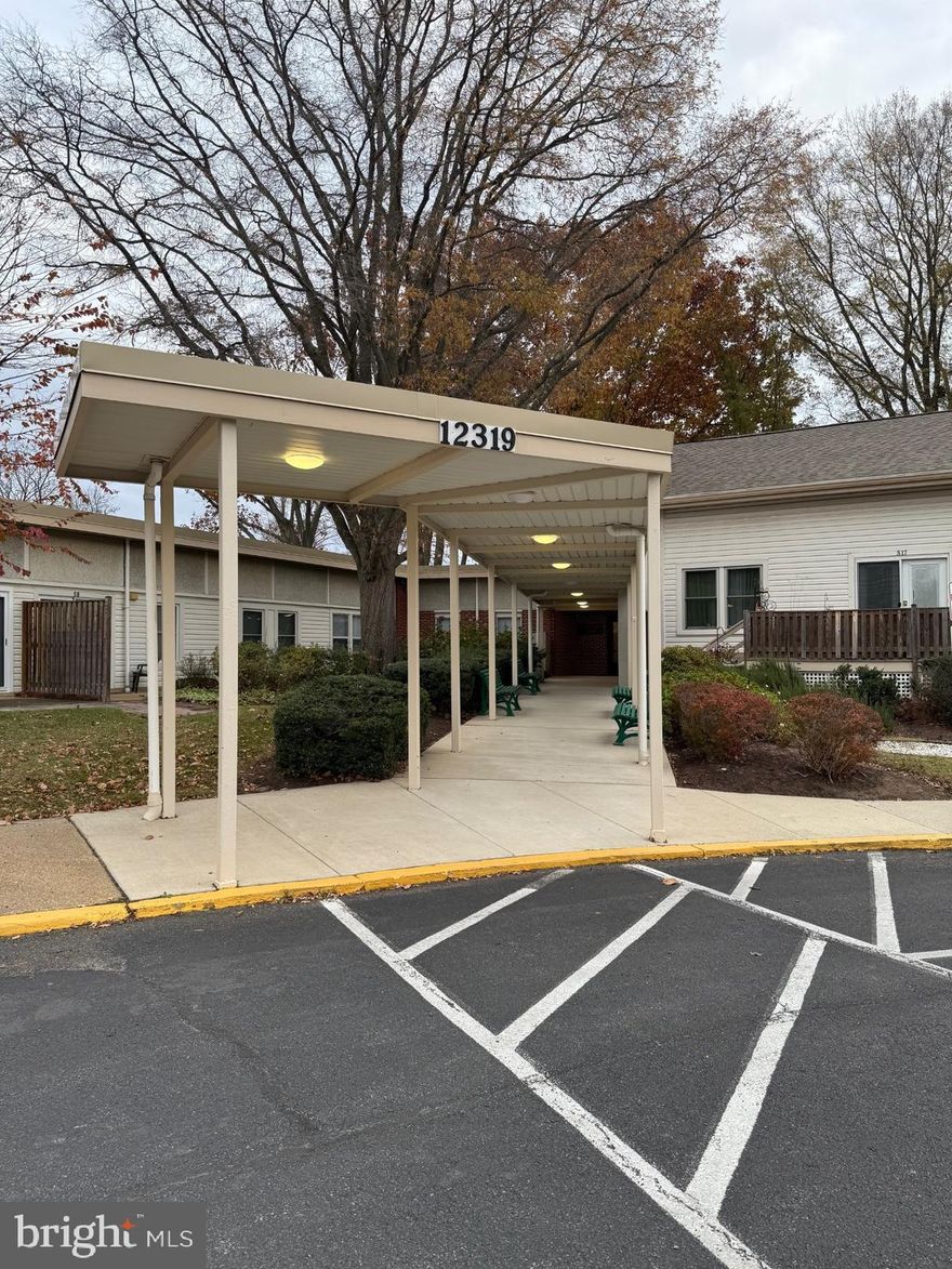 55+ community waiting for you to call it home! The unit is in a secure building. Welcome to this bright and inviting 1-bedroom, 1 full bathroom condo! Enter to find the living room and dining room combo that has a sliding patio door overlooking the patio and a peaceful green area. Perfect for relaxing while enjoying the outdoor serenity and beauty. The kitchen has new appliances. There is new vinyl plank flooring, fans, lighting, and the unit is freshly painted. Community meeting room, storage and parking available. "As Is". Don't miss this rare opportunity to live in a comfortable, clean, secure, and friendly senior community! Parking available. Ideally close to shopping. The Bowie Senior bus is available to schedule rides to appointments,  shopping, the Bowie Senior Community Center, and other area destinations.