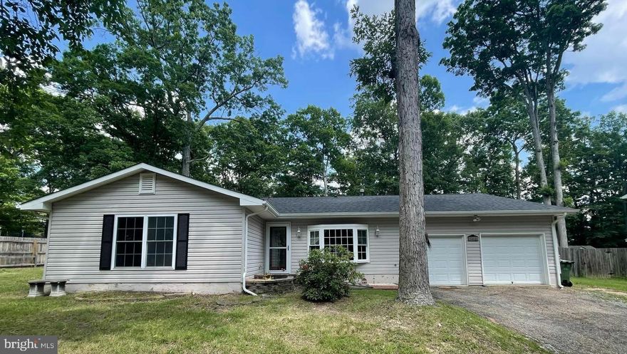 Beautifully updated 4 bedroom Rambler near I-95 and Spotsylvania Mall! This home has a gorgeous kitchen with exotic granite on the island, stainless steel appliances, white shaker cabinets, and self closing drawers. The skylight adds bright & natural light to the kitchen.  Enjoy eating meals next to a wood burning fireplace beside the eat- in area.  The oversized 2 car garage with 13' x 10' extra space is perfect for holiday decor storage. Recessed lighting is a great feature throughout this home. The dining room is currently being used as an Office. Backyard is fully fenced to keep the littles and the pets safe and sound. Primary bath and hall bath have been nicely updated!  
New roof done 1 1/2 years ago, HVAC is 2 years old, dishwasher less than a year old, brand new refrigerator with ice maker.   No HOA !