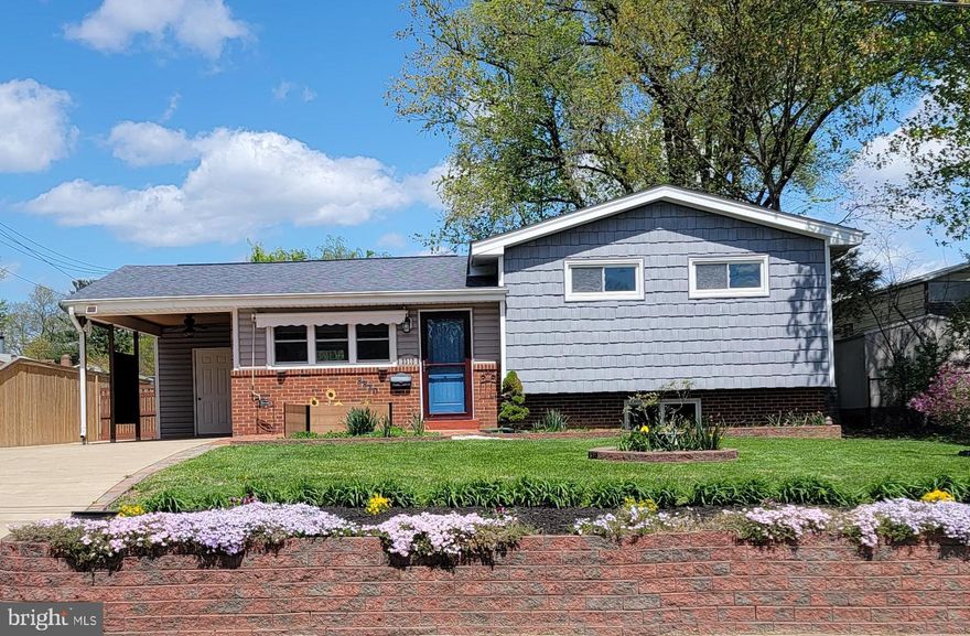 Welcome to the peaceful Valley View neighborhood (no HOA). This split-level home sits on a nearly a quarter of an acre of land and features a large concrete driveway, a carport, a perfectly level fenced backyard, and a large shed. Imagine yourself sitting on the brick front porch, under the awning, sipping your favorite drink.

Step inside to discover spacious rooms and gleaming refinished hardwood floors. The updated eat-in kitchen has been completely renovated, boasting granite countertops, wood cabinetry, a stylish backsplash, and stainless steel appliances. Patio doors will take you to a freshly stained deck.

On the upper level, you'll find three generously sized bedrooms and a fully renovated bathroom that includes a jetted tub, ceramic floor and a beautiful vanity. The lower level offers ample storage closets, a recreation room, and a laundry room equipped with a front-load washer and dryer, and a full bath. A list of improvements is included in the "document" section of Bright! 

Despite its tranquil setting, this property is conveniently located just two miles from the Huntington Metro, making commuting to Washington, DC, a breeze. Additionally, the vibrant shops and restaurants of Old Town Alexandria are just a few minutes away, offering easy access to a variety of amenities. 

Experience life on Arundel Avenue, where peaceful living meets the convenience of modern life.

Still accepting  offers!