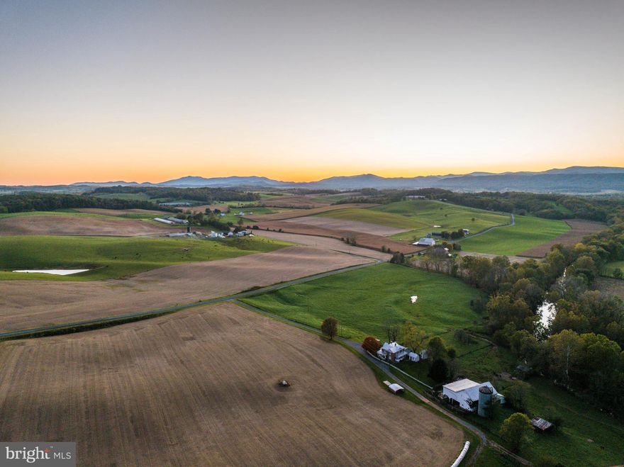 Discover a rare opportunity to own this breathtaking 119+/- acre farm, offered to the public for the first time in nearly a century. Located in the heart of the Shenandoah Valley, this remarkable property offers a blend of agricultural productivity, natural beauty, and historic charm. The farm features over 50 acres of productive tillable grounds, currently planted with soybeans and corn, and supported by Class I and Class II soils ideal for continued crop production. Additionally, more than 20 acres of fenced pasture are available ready for grazing livestock, complete with convenient water access. The property boasts over half a mile of private frontage on both sides of the North River, giving you exclusive access to one of Virginia's most renowned fly-fishing rivers. The centerpiece of the property is a 3,986 sq.ft Craftsman-style home, built in 1930, and which retains many of its original architectural features and details. The home sits along a quiet stretch of Jordan Hill road, offering over a quarter mile of road frontage for easy access. A network of interior roads allows for effortless travel throughout the farm. Don't miss your chance to explore this truly once-in-a-lifetime offering.