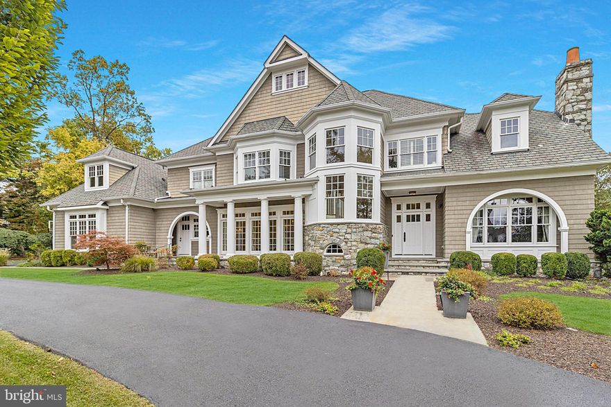 Rare opportunity to own this luxurious newer stone and shingle masterpiece designed by renowned architect Glenn Fong and built by Augustine Builders, situated on a gorgeous one-acre lot, only 1.5 blocks from Potomac Village.  The extraordinary outdoor living spaces include spectacular heated pool with waterfall, pool house with delightful summer kitchen and covered porch plus additional full bath. You'll love the putting green, firepit, expansive patio, and additional screened porch!  Beautifully maintained and updated throughout including gourmet kitchen, fabulous great room, huge formal living and dining rooms, study and expanded laundry/mud room. The upper level features a dramatic primary suite with modern, luxurious four-piece bath and dual spacious walk-in closets, as well as four additional bedrooms, each with adjoining bath. The fully finished lower level offers theater, gym, wine cellar, and an additional bedroom and full bath. You'll find high ceilings and topnotch designer features throughout. Four-car garage parking.