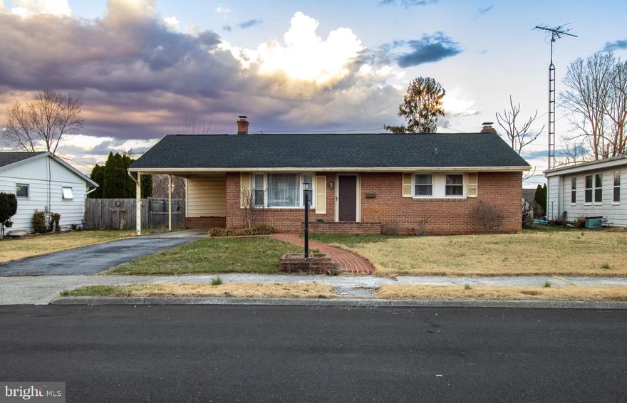 Brick rancher in an established neighborhood close to everything but not in the middle of everything.  Minutes to the interstate and walking distance to parks and schools 3 bedrooms one bath.  Hardwood floors in the living room and bedrooms.  Large family room in the basement with a wood stove. Area in the basement for storage.  Covered patio off the kitchen leads to a great sized backyard.  Carport is great for bad weather and has access to the kitchen door.