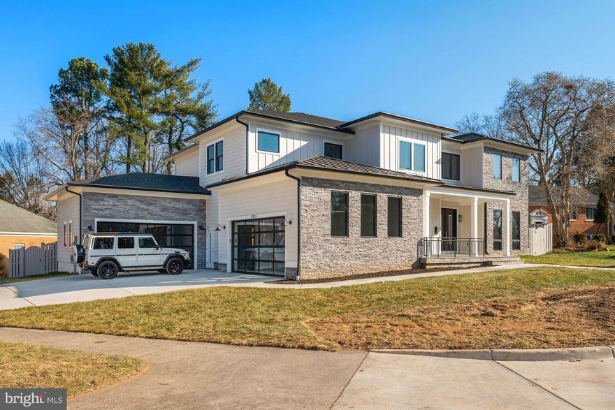 Beautiful contemporary custom-built new home. Six ensuite bedrooms, 7 .5 baths with over 7,800 sq ft finished living. Sited on .34  acre corner lot with fenced yard and four car garage with concrete driveway. Screened porch with fireplace and deck for entertaining. Terrific lower-level rec room with fireplace and bar, gym, media room, bedroom and two full baths.  Fabulous Mclean location.