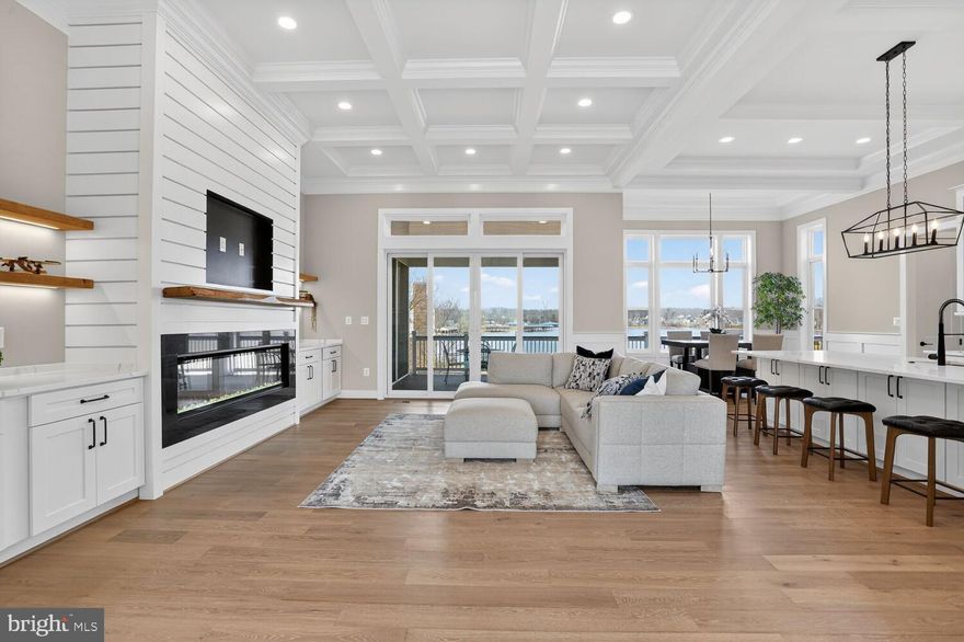 Exceptional Water-View Custom Home | Move-In Ready | Deeded Boat Slip #B3 | STR Permitted . 
NOTE:- The builder will enhance the shoreline and backyard with several premium upgrades, including the addition of a sandy beach area, a 16' x 16' pavilion,, and a fire pit. The backyard will also be regraded to create a flatter, more usable lawn, along with the construction of a retaining wall for improved landscaping and functionality.
Discover this exceptional modern design, upscale finishes, water access, spectacular lake views, and a premier location. This home delivers the very best of Lake Anna living. , move-in-ready, Set on a private cove shoreline in the prestigious Rock Island Landing subdivision on the private side of Lake Anna. This rare offering includes a private paved boat ramp, a covered deeded boat slip, and short-term rentals are permitted, making it ideal as a luxury retreat or a high-performing investment.

Offering 4,407 sq. ft. of beautifully finished living space, this home features an open-concept design with 6 bedrooms, 4 full bathrooms, and 1 half bath, thoughtfully designed for comfort, flexibility, and lake living.

The main level showcases a lake-view primary suite, two additional bedrooms with a Jack-and-Jill bath, a home office, and a dining area. The great room, foyer, kitchen, and dining area all feature 12-foot ceilings, a fireplace, and expansive sliding glass doors that frame breathtaking lake views and open to a screened porch and sundeck with an outdoor fireplace, perfect for entertaining and year-round enjoyment.

The gourmet kitchen impresses with 12-foot ceilings, a 10-foot quartz center island with seating and built-in sink, abundant cabinetry, a pantry, and a laundry room—blending elegance with everyday functionality.

The primary suite offers a peaceful lake-view retreat with 10-foot ceilings, custom windows, sliding door access to the screened porch, a spacious walk-in closet, and a spa-inspired bath featuring dual vanities, a freestanding soaking tub, and a separate shower.

A 645 sq. ft. finished bonus room includes a full bath, walk-in closet, and a private balcony with stunning lake views—ideal for guests or a flexible living space.

The fully finished walk-out lower level spans approximately 2,046 sq. ft. and features a large recreation room with lake views, a full kitchen, a third fireplace, a media room, and two bedrooms connected by a Jack-and-Jill bath. This level opens to a patio pre-wired for a hot tub, enhancing the home’s exceptional indoor-outdoor lifestyle.

Additional features include a covered front porch, rear decks, a mudroom, resource room, built-ins, closets in every bedroom, abundant natural light throughout, a two-car attached garage, and a paved driveway and sidewalk.  With modern design, upscale finishes, water access, spectacular lake views, and a premier location, this home delivers the very best of Lake Anna living. 

Conveniently located near The Boardwalk at Lake Anna, with easy access to Richmond, Charlottesville, Fredericksburg, and Washington DC.