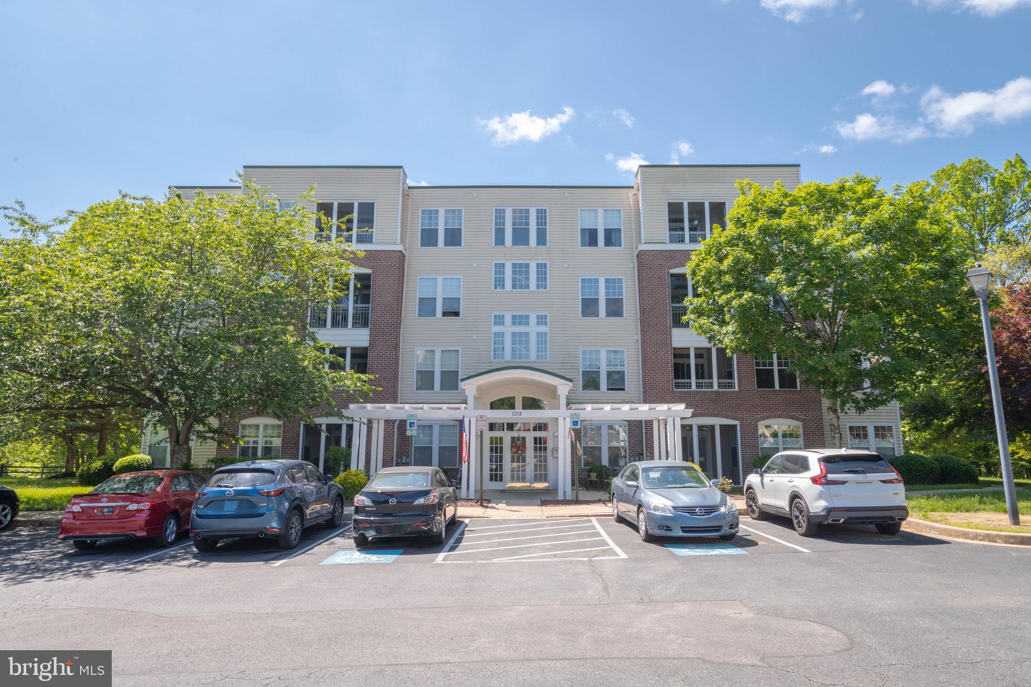 Welcome to your new home, this charming and inviting 3-bedroom, 2-bathroom ground floor condominium nestled in a well-maintained community with its own private entrance via the built-in sunroom/porch. Built in 2000, this contemporary unit with 9ft. ceilings and custom trim offers a perfect blend of comfort and convenience, making it an ideal choice for anyone seeking a peaceful retreat with modern amenities. As you step inside, you'll be greeted by a spacious layout that maximizes natural light and creates a warm atmosphere. The well-appointed living spaces are perfect for both relaxation and entertaining, providing ample room for gatherings with friends and loved ones. The unit features a new washer and dryer ensuring that laundry day is a breeze. The kitchen features gorgeous, white, quartz counters, white cabinetry, backsplash, and all stainless steel appliances. Adjoining the kitchen is a small bump out with a casual dining area with a custom island that also has quartz counters and built in cabinetry, as well as plenty of sitting room. Off of the kitchen you’ll find a beautiful barn style sliding door that opens into a potential third bedroom, office, or den area with plenty of of windows for natural lighting. On the other side of the kitchen is a hallway that leads to the primary suite with a fully remodeled bathroom and large walk-in closet with custom shelving. Down the hall and through the living area, you’ll find an additional fully remodeled bathroom, a separate laundry closet with custom shelving and another large bedroom with its own oversized, walk-in closet. Most recent updates include all new LVP flooring throughout, fresh paint, new water heater, new vanities, in bathrooms with wainscoting, new shower door in second bathroom, and new sliding door to the screened in porch with built-in blinds. The property boasts a variety of community amenities designed to enhance your lifestyle. Enjoy sunny afternoons by the outdoor pool, or stay active at the fitness center. The community also features tennis courts and a clubhouse, perfect for socializing and making new friends. With beautifully maintained common grounds and a recreation facility, there’s always something to do right at your doorstep. The association fee covers essential services such as lawn maintenance, snow removal, and trash collection, allowing you to enjoy a worry-free lifestyle. You’ll appreciate the convenience of having these services included, giving you more time to relax and enjoy your surroundings. Parking is hassle-free with plenty of parking. The building is designed with accessibility in mind, featuring an elevator for easy access to your unit. Located in a vibrant community, this property is close to local amenities, making it easy to enjoy shopping, dining, and recreational activities. Whether you’re looking for a peaceful place to unwind or a lively community to engage with, this apartment offers the best of both worlds. Don’t miss the opportunity to make this lovely apartment your new home. With its excellent condition, desirable features, and welcoming community, it’s the perfect place to create lasting memories. Schedule a visit today and experience the warmth and charm of this wonderful property” for yourself!