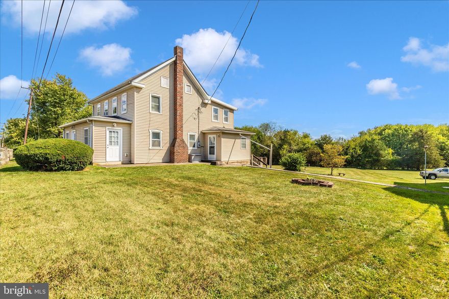 Discover the perfect balance of history and convenience in this 1878 sq. ft. farmhouse, set on a spacious .75-acre lot.  Built in 1859, the home retains its timeless character with original details like wood-slat farmhouse doors, while offering smart updates to give peace of mind to today's buyer. 

Major Updates Include:
* Roof replaced in 2017
* Windows updated & wrapped for efficiency
* Electrical system upgraded in 2006
* Front & side porches enclosed (2006) permitted and inspected
* Laundry relocated to main level
* Well & Septic installed 

 Step inside to discover a warm and inviting interior, highlighted by solid hardwood flooring and a traditional, circular floor plan that seamlessly connects the dining area, living room, den and kitchen. The home boasts four spacious bedrooms with one full bathroom and an additional half bath.  The kitchen and bathrooms are in good condition, ready for your cosmetic updates to reflect modern style.  

Outside, enjoy your morning coffee off the back deck, or simply unwind while enjoying the natural surroundings.  The level backyard, backing to trees, offers ample outdoor space for recreation, expansion, or entertaining.  Multiple outbuildings offer versatile storage solutions or potential workshop space.   

This farmhouse is move-in ready, with many big ticket items already addressed--leaving you free to add your own style and vision.