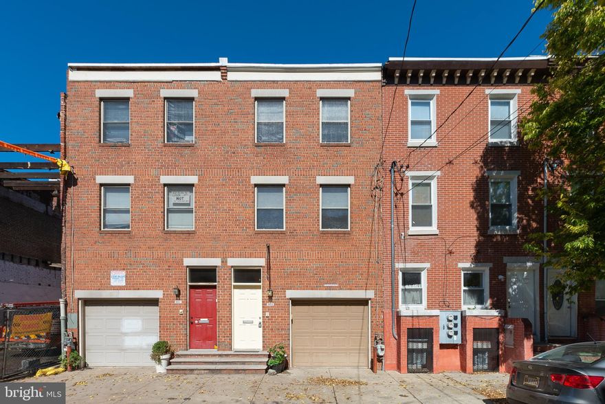 The Stawasz Group presents 1615 Bainbridge Street located in the GREENFIELD catchment of Graduate Hospital. With GARAGE PARKING, a 98 WALK SCORE, and ROOF DECK with center city views, what more do you need? Before even entering, you'll notice the convenient front loaded one-car garage, with extra room for storage. Inside, you'll be greeted by newly stained natural hardwood flooring with a living room featuring crown molding and gas fireplace. Adjacent to the living room is the dining area and kitchen featuring granite counter tops, stainless steel appliances, tile backsplash, bar seating, and pantry closet. Following the sliding doors outside, you'll find access to the huge rear outdoor area, perfect for a personal garden or cookout destination with family and friends. Before heading upstairs take a quick trip to your dry, unfinished basement which can be used as storage or take advantage of the fantastic ceiling height and finish yourself! Moving upstairs to the second floor, you'll notice two full-sized bedrooms, a full bathroom, laundry room, and spacious living room which is a perfect play space for kids. Finally, on the third floor you'll find the luxurious master bedroom, encompassing the entire floor, this space is so large you could fit another bedroom or office! The master bedroom also boasts a private bathroom, a walk in closet, large sky light and entrance to the outdoor roof deck with center city views! Located only two blocks from the acclaimed bars and restaurants of South Street and approximately a half mile from Rittenhouse Square, this charming property won't last long, so schedule your tour today!