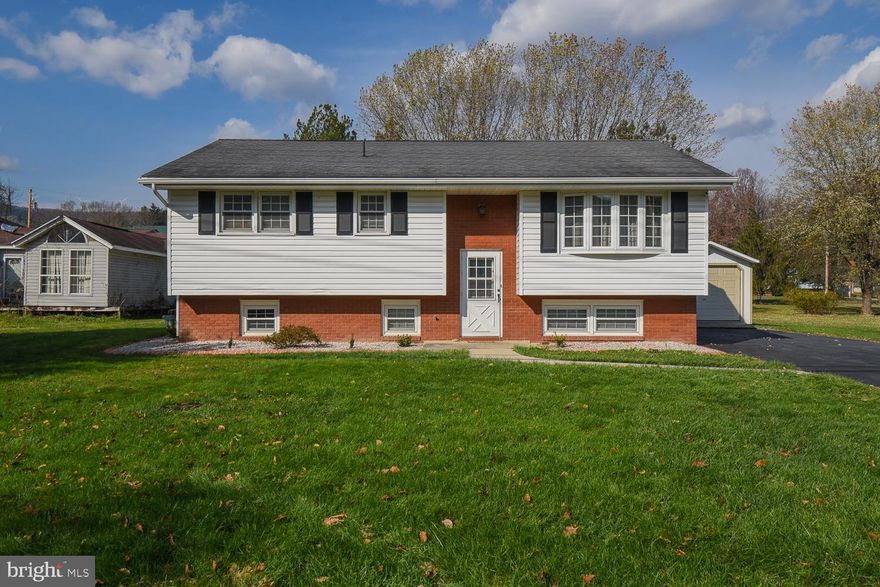 You won't want to miss the view of the mountains from this one!! Beautiful split level home on the outskirts of town. 3 bedroom, 1 bath on the upper level. Lower level includes one full bath, large rec room with a custom built bar, laundry and an additional room to be finished that can be your guest bedroom, home office, etc. Nice and level lot with a huge deck for entertaining guests or relaxing on a nice evening. Kitchen has some recent renovations with brand new backsplash and counter tops with refinished cabinets with new hardware. Central AC unit replaced in 2022. Upstairs flooring, doors and appliances all replaced January 2023.