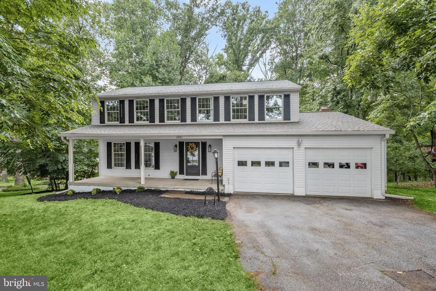 Sellers are offering a $5,000 credit. 
This gorgeous colonial home is truly stunning, with four bedrooms and a quiet location at the end of a cul de sac. The interior has been fully renovated, featuring a freshly painted neutral color palette and updated modern features throughout. As you approach the home, you are welcomed by a covered front porch, providing the perfect spot to enjoy your morning coffee. Inside, the main level showcases refinished hardwood floors and an abundance of natural light from the windows. The living room offers a cozy space to unwind and seamlessly flows into the dining room, which is beautifully adorned with accent chair railing, adding an elegant touch for entertaining guests. Prepare your favorite meals in the kitchen that is equipped with brand new stainless steel appliances, stunning quartz countertops, a subway tile backsplash, pantry, and an adjacent breakfast nook for casual meals. For relaxation, the family room awaits with a sun-drenched skylight, bay window, and a wood stove featuring a brick surround and wood beam mantle. Sliding glass doors lead to an expansive deck, connecting indoor and outdoor living spaces. Finishing the main level is a half bathroom and access to the two-car garage. Moving upstairs, the primary bedroom suite is a luxurious retreat, boasting a large walk-in closet and a private bathroom with a dual sink vanity and a walk-in shower. Three additional spacious bedrooms and a second full bathroom complete the upper level, with new plush carpeting and luxury vinyl plank flooring in the bathrooms. The lower level is ready for your finishing touches, offering ample space and flexibility to suit your needs. It includes laundry and sliding glass doors that open to a rear patio. The peaceful setting backs to trees, providing a serene and tranquil atmosphere. Brand new landscaping adds a beautiful touch and the shed in the rear yard gives plenty of storage space. This property is an estate and being sold As-Is.