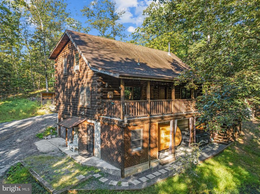 Discover this stunning log home, a proven Airbnb short-term rental investment. As of today, the property has already generated $62,000 in income and is on track to reach $100,000 in 2025.
ALL furniture to convey, including HOT TUB and SAUNA. 
This is a turnkey Airbnb-ready. 
Inside, you’ll be welcomed by an inviting open-concept kitchen and living area—ideal for gatherings and entertaining. The main floor hosts a spacious primary suite, a convenient half bath, and a laundry room. Upstairs, you’ll find two cozy bedrooms, a versatile room perfect for an office or storage, a full bathroom, and an open gaming area that’s perfect for fun and relaxation.

The lower level expands the living space with two additional bedrooms, a full bath, and a theater room—an excellent spot for movie nights or watching the big game. The attached garage offers parking plus a second washer and dryer for extra convenience.

Step outside to unwind in the hot tub, enjoy the covered porch while spotting local wildlife, or take advantage of the charming matching shed for additional storage.

This property comes fully furnished and completely turnkey—ready for you to enjoy as a personal retreat or continue operating as a highly successful rental.