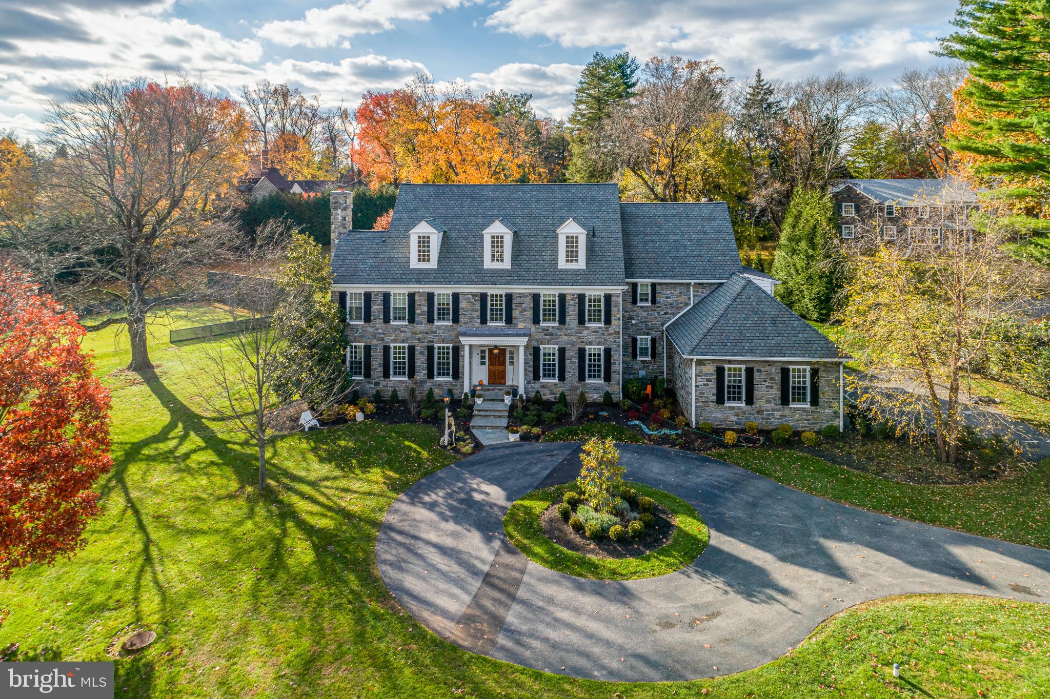 Look no further! Finally a custom turn-key home on a sub dividable lot on a gorgeous tree lined street in Gladwyne with a tennis court! This home has it all including 3+ acres of gated manicured grounds with all the bells and whistles one would want for todays lifestyle. 8,000+ square feet of impeccable living spaces including soaring ceilings, hardwood floors, 4 fireplaces, oversized windows, generous room sizes, designer finishes at every turn and a wonderful floor plan. This home has recently underwent extensive upgrades with stunning modern baths and a jaw dropping first floor addition complete with a professional bar, fireplace with floor to ceiling stone, metal windows and doors which create the perfect indoor/outdoor living space. The gourmet chef's kitchen features quartz countertops, top of the line Wolf and Subzero appliances and two islands. 5-6 spacious bedrooms with 6 full and 3 half baths. The master suite complete with separate morning bar with beverage cooler, enormous walk-in closet, bathroom suite with radiant heated floors, soaking tub and walk-in shower. There is also a family lounge/tv room on the second floor. The recently completed third floor with vaulted ceilings provides the perfect recreation space featuring a gaming room, media room, basketball/golf room, wet bar and 2 modern baths. This property can be subdivided and has room for a pool (pool permit available).