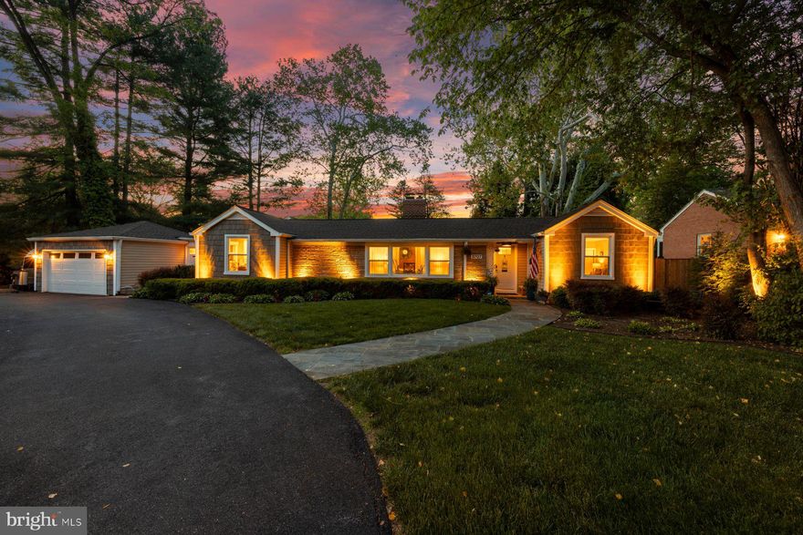 Welcome to this mid century modern ranch corner lot residence featuring 3 bedrooms, 3.5 bathrooms set on 0.35 acres in  Chevy Chase neighborhood. Offering nearly 3,107  square feet ( buyer to verify; tax records may differ) of beautifully designed living space, including the expansive heated swimming pool with waterfall, 2 car garage, and fully fenced yard. This move-in-ready home blends timeless craftsmanship, modern comfort, and an array of unique features. From the moment you enter, the home reveals an elegant and thoughtfully curated interior. A stunning great room addition with soaring ceilings and a dramatic stone fireplace creates a warm yet grand focal point for everyday living and entertaining. Two additional fireplaces in the family room and master bedroom, all recently renovated. The open luxury kitchen is beautifully appointed with Electrolux appliances, a Bosch dishwasher, induction cook top, granite countertops, soft-close drawers, and seamless flow into the dining area and family room, complete with a bar area designed for effortless gatherings.
One of the home’s most distinctive features is its hidden spa retreat, tucked discreetly behind a library door. This private sanctuary offers a jetted tub with heat pump, a Viking sauna for five, and oversized skylight that fills the space with natural light, creating a serene, resort-like ambiance. Ceiling speakers throughout the home (inside and outside) allow for a fully immersive atmosphere, ideal for music, relaxation, and entertaining.
The spacious primary suite is a true retreat, featuring a newly renovated bathroom with dual sinks, marble countertops, an electric fireplace, and custom his and hers closet organization along with a dedicated cedar closet. A large integrated study is attached to the primary suite, perfect for work, coffee bar and sitting room. The primary suite and great rooms have also been thoughtfully updated with new Mitsubishi mini-split HVAC systems with Wi-Fi app control, fresh paint, new hypoallergenic carpet installed in 2024, and new automatic blinds. A bonus room provides excellent flexibility for a home office, gym, or guest space.
Outside, the property continues to impress. The expanded driveway includes a 30-amp receptacle for an RV. The backyard is designed for exceptional outdoor living, with a heated swimming pool, a new composite deck, WiFi controlled landscape lighting and electric heaters under the waterproof pergola with adjustable louvers—perfect for entertaining or quiet evenings at home. Surrounded by lush landscaping and mature trees enclosed by a private cedar fence, the yard also features a Wi-Fi-controlled sprinkler system for ease and convenience.
Additional updates and features include kitchen remodel (2013), closet cabinetry (2014), Spa (2016), 3 large exterior siding door panels with access to deck (2016), pool recently renovated (2021), Driveway expanded (2022), 2 new electrical panels with whole house surge protection (2023), master bedroom and master bath (2023), new roof with ridge vents and skylights (2024), landscaping including sprinkler (2024), replacement windows, doors, by Andersen and Window World, with transferable lifetime warranties (2025) and a gym area is also included, with equipment negotiable. Plenty of storage and shelving in the attached shed with room for lawn equipment, bicycles, holiday supplies and wood working tools.
Ideally located near downtown Bethesda, Friendship Heights, New Purple Line Metro access (10 min walk), The Shops at Wisconsin Place, Trader Joe’s, over 300 popular and boutique dining destinations, this home also offers close proximity to Rock Creek Park, Woodend Sanctuary, Meadowbrook Stables, and Meadowbrook Local Park. With easy access to the Beltway, Silver Spring, Bethesda, and Washington, D.C., this remarkable property delivers the perfect balance of refined indoor living, exceptional outdoor enjoyment, and unmatched convenience.