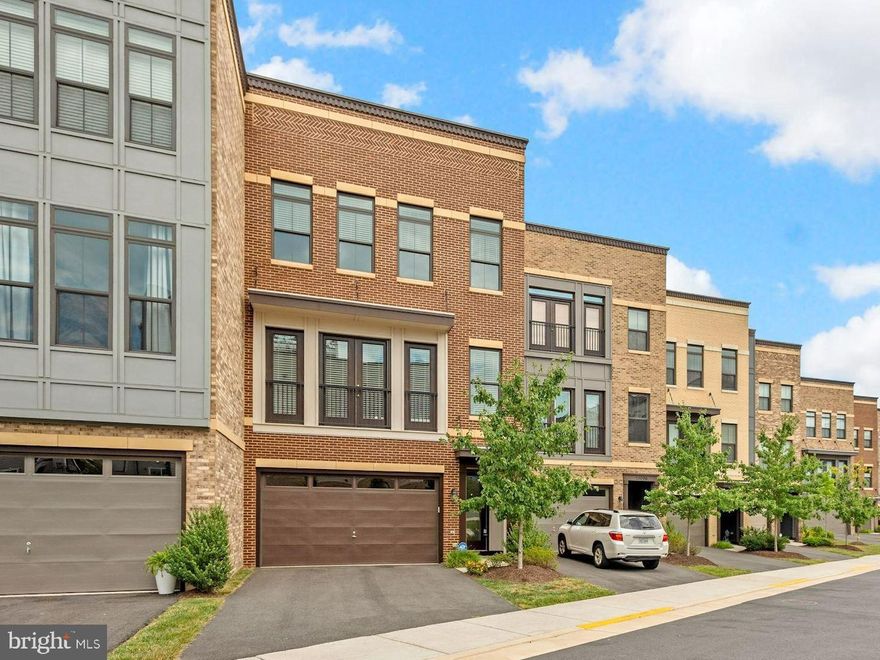 Prepare yourself to take in this breathtaking Brambleton Pond waterfront home, first time to be offered for rent, extensive upgrades and improvements with over $120,000. Entryway stairs lead you up to the main level with a masterfully updated kitchen featuring white and gray quartz countertops, deluxe kitchen island, updated Thermador appliances, and 42-inch Shaker cabinets that extend all the way up to the 10-ft ceilings. Invite your friends over to enjoy your private balcony overlooking the pond and step-in to your 7-person hot tub overlooking the gorgeous view. Pour yourselves a perfectly chilled glass of wine from your new included wine fridge. And once you're done with that, head on up to your private rooftop terrace for more views and a fully equipped outdoor kitchen to get dinner started on a warm evening. Open up your recipe books to make use of your built-in gas grill, gas cooktop burner, mini fridge, bar sink, and prep station. Continue to entertain your guests at the built-in bar or relax under the pergola. And if you find yourself needing more space, for work or play, take advantage of the versatile lower level bonus room. This luxurious home is guaranteed to have something for everyone, between the hot tub, rooftop bar, rooftop tv and sound bar, balcony, wine fridge, water views, and fenced-in HOA-maintained yard. All is conveyed except for curtains in living room and guest room. Make sure to get your turn to see it before it's gone!