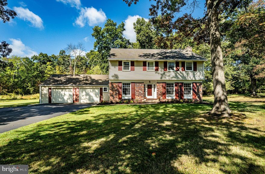 Welcome home to 8 Andrews Road, Malvern, PA!  
This beautiful 4-bedroom, 2.5-bath front-to-back split-level home in Willistown Township sits on a 2.2 wooded acre corner lot in one of Malvern’s most desirable neighborhoods. With four levels of living space, brand-new carpet, refinished hardwood floors, and fresh paint throughout, the home is move-in ready while offering the opportunity to add your personal touch to the kitchen and bathrooms.
The main floor entryway opens to a beautiful formal living room with large windows and a cozy fireplace.  The large dining room boasts plenty of natural light and closet for storage, perfect for large family gatherings. The kitchen has plenty of cabinets and countertops for easy prep space, including an island and space for seating.  A two-story addition adds incredible living space, featuring a spacious family room off the kitchen with brick fireplace and huge picture window with views overlooking the backyard. The family room also showcases a spiral staircase leading to the upper and lower levels and the side door exits to the covered porch and garage. The large lower-level room is versatile and can be used as a rec room, game room, gym, etc. There is a powder room and laundry room with access to the side yard. The mid-level includes 2 nice sized bedrooms, a full bath, linen and hall closets.  The upper level hosts a large bedroom with 2 double closets and a full bath with brand-new tub-to-shower conversion and linen closet.  The large primary suite has plenty of closet space and an expanded room with natural light perfect for a private retreat, home office, or library/sitting area. The spiral staircase leads back down to the family room. Finally, the top level houses a full walk-up attic for additional living space or storage.
Outside, the property shines with a large, level corner lot and side covered porch and patio to enjoy your morning coffee, BBQ's and nature.  The detached carriage house with electric could be used as a garage, She-Shed, man cave, hobbies or additional storage.
Don’t miss this chance to own a versatile home with room to customize and grow in the highly sought-after Great Valley School District and a short distance from shops, restaurants, and the Malvern train station.