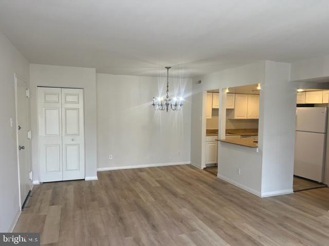 Sunny one bedroom condo, facing club house, trees and parking area. Condo unit is located on top floor with nice scenic view of community. Unit has been painted updated flooring and washer and dryer in unit. Located across from Prince Georges Community College, shopping and I95/495.