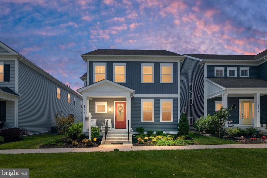 Welcome to 1602 Canary Grass Drive, a beautifully designed Craftsman-style colonial by Mitchell & Best, located in the highly sought-after Two Rivers community of Odenton. This spacious 5-bedroom, 4.5-bath home offers over 4,000 square feet of thoughtfully finished living space across three levels. Inside, you'll find a bright open floor plan with 10-foot ceilings, a formal entry, and a main-level office ideal for working from home. The gourmet kitchen features upscale cabinetry, quartz countertops, a large center island, stainless steel gas appliances, and a walk-in pantry, all flowing seamlessly into the sunlit family room. Step outside to a custom patio with a pergola—perfect for entertaining or relaxing outdoors. Upstairs, the luxurious primary suite includes a sitting area, two walk-in closets, and a spa-style bath with a freestanding soaking tub and separate glass-enclosed shower. Three additional bedrooms, two full baths, and a convenient laundry room complete the upper level. The finished basement adds versatility with a large rec room, fifth bedroom, full bath, and space for a home gym or media room. Designed with safety in mind, the home includes a full in-home sprinkler system and is uniquely positioned with fire hydrants at both the front and rear of the property. Residents of Two Rivers enjoy resort-style amenities including a clubhouse with fitness center and indoor basketball court, outdoor pool, tennis and pickleball courts, volleyball, scenic walking and biking trails, a tranquil lake, dog park, tot lots, a 160-acre nature preserve, and a community garden. Ideally located near Waugh Chapel shopping and dining, Fort Meade, the MARC train, and major commuter routes, this exceptional home offers luxury, comfort, and lifestyle all in one.