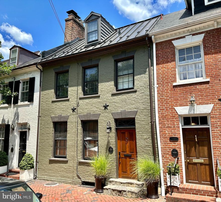 Four level historic Federal row house (built 1804) will charm with its unique, stylish interior and curb appeal.  Original wood flooring and brick archways are found throughout the house. The fabulous, and recently updated, kitchen (with Miele appliances) has views of the large back garden. There is a spacious separate dining room. The two working, and original, fireplaces invite routine use - one in the main floor front parlor. Lovely primary bedroom includes an updated bath; adjacent is a stunning light-filled library with built-ins, vaulted ceilings, and skylights. There is a second bedroom with a fireplace and an updated Spanish tile and limestone bath. The light-filled third floor is multi-functional with a built-in captain's bed and cedar- lined closet; it is currently used as an office/guest bedroom. The whole house is a great space for displaying art. The basement level is where you will find the major systems of the house and a Miele washer/dryer. It is a treat to view the 200+ year old exposed beams and the old coal chute. The deep brick walled garden is stunning. Just off the kitchen, it has automatic lighting, a small pond, beautiful plantings with mature trees and a circa 1920's storage building with back alley access. This shed will store all your sports gear, garden paraphernalia, etc.  The entire house, inside and outside, has been wonderfully maintained and updated. Some of the numerous updates are: Skylights 2 years, A/C (2), Burnham furnace (9), Electric system (2), Rinnai on demand water heater (1), Front metal roof (9), Back roof (12) and Custom Front door (2). Closed 11/13/23