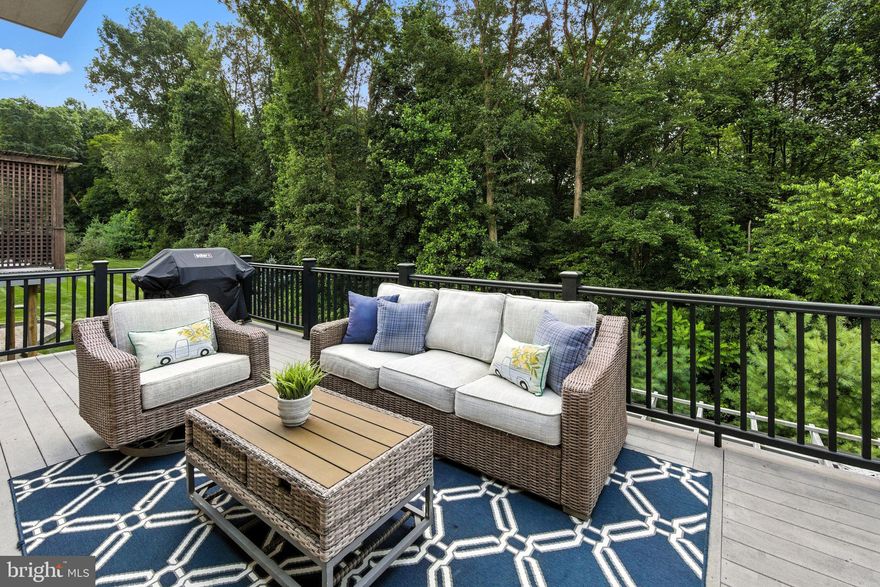 This is the best VALUE for the combination of the most desirable lot, large square footage, and location in the community! Prepare yourself to be impressed! This home shows like a model and the private lot can not be beat! Totally refreshed with thoughtful upgrades and exquisite details, if you're seeking to move to a 55+ community without sacrificing the features and space of a single-family residence, look no further. The size of this home is generous including areas for family gatherings, guest accommodations, a home office, entertainment and hobbies. Enjoy spectacular views , space between neighboring homes and expansive outdoor spaces designed for relaxation and socializing.

Only an out-of-state move has made this pristine, like-new property available. As you arrive, you'll notice the evident pride of ownership in this meticulously cared-for home. Enter through the gracious foyer, where fresh paint, gleaming hardwood floors, custom window treatments, abundant recessed lighting, and elegant oiled bronze hardware welcome you.

At the heart of the home lies a grand,  modern open area, featuring a spacious kitchen with handsome, creamy cabinetry, exquisite quartz countertops, stainless steel appliances, a generously sized pantry, and an expansive center island, complemented by an inviting dining area, complete with a cozy gas fireplace and custom built-ins. This space seamlessly flows into the expansive Family Room area which expands out to a low-maintenance TimberTech deck with stylish black railings, overlooking serene trees and providing access to the private backyard.

Arched doorways add character as you proceed to the elegant first-floor primary suite. The primary bedroom features a beautiful tray ceiling with uplighting and a ceiling fan, a transom window, and a custom Closets By Design walk-in closet. The primary bathroom is spacious and bright, with an oversized shower, soaking tub, updated vanity and extra cabinetry. Another main floor room, enclosed by glass French doors, serves as a quiet home office or additional bedroom, accompanied by a full guest bathroom. A convenient laundry room and immaculate two-car garage complete the main floor.

Upstairs, you'll find a large open loft area, complete with its own bedroom, full bathroom, and a stupendous custom closet. This level is ideal for a live-in relative, guests, or as a separate area for quiet activities, reading, crafts, or an additional home office.

The lower level is a true showstopper, offering expansive space for entertainment and recreation. Handsome wood flooring leads you to a custom wet bar with a sink, wine and beverage fridges, custom cabinetry, and shelving. This area also features another gas fireplace, custom built-ins, and plenty of room to watch the big game or movies and enjoy family time. A separate room can be used as a guest bedroom, hobby room, or additional home office. There is another great full bath and two generously sized storage rooms completing the lower level. Step outside to the charming rear paver patio with a pergola, perfect for savoring the serene backyard views and sounds.

This home was constructed with upgraded landscaping and hardscaping, gutter guards, an enhanced exterior lighting package, sprinkler system, alarm system, and water softener, leaving no detail overlooked.

Located in the desirable Honeycroft Village community, residents enjoy access to a pool area, fitness center, bocce ball, horseshoes, a fire pit and community garden. With lawn care, snow removal, and trash services taken care of, you can move in and start enjoying life. Nearby, you'll find restaurants, farmers' markets, golf courses and shopping. Schedule your private tour today! Homestead exclusion could be applied for tax savings.