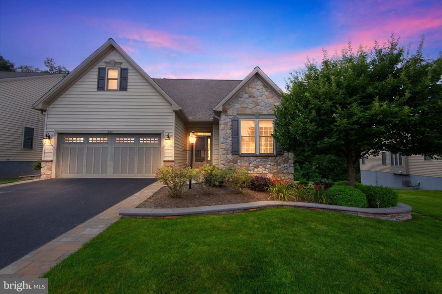 Prepare yourself to be impressed! This home shows like a model and the private lot can not be beat! Totally refreshed with thoughtful upgrades and exquisite details, if you're seeking to move to a 55+ community without sacrificing the features and space of a single-family residence, look no further. The size of this home is generous including areas for family gatherings, guest accommodations, a home office, entertainment and hobbies. Enjoy spectacular views and expansive outdoor spaces designed for relaxation and socializing.

Only an out-of-state move has made this pristine, like-new property available. As you arrive, you'll notice the evident pride of ownership in this meticulously cared-for home. Enter through the gracious foyer, where fresh paint, gleaming hardwood floors, custom window treatments, abundant recessed lighting, and elegant oiled bronze hardware welcome you.

At the heart of the home lies a grand,  modern open area, featuring a spacious kitchen with handsome, creamy cabinetry, exquisite quartz countertops, stainless steel appliances, a generously sized pantry, and an expansive center island, complemented by an inviting dining area, complete with a cozy gas fireplace and custom built-ins. This space seamlessly flows into the expansive Family Room area which expands out to a low-maintenance TimberTech deck with stylish black railings, overlooking serene trees and providing access to the private backyard.

Arched doorways add character as you proceed to the elegant first-floor primary suite. The primary bedroom features a beautiful tray ceiling with uplighting and a ceiling fan, a transom window, and a custom Closets By Design walk-in closet. The primary bathroom is spacious and bright, with an oversized shower, soaking tub, updated vanity and extra cabinetry. Another main floor room, enclosed by glass French doors, serves as a quiet home office or additional bedroom, accompanied by a full guest bathroom. A convenient laundry room and immaculate two-car garage complete the main floor.

Upstairs, you'll find a large open loft area, complete with its own bedroom, full bathroom, and a stupendous custom closet. This level is ideal for a live-in relative, guests, or as a separate area for quiet activities, reading, crafts, or an additional home office.

The lower level is a true showstopper, offering expansive space for entertainment and recreation. Unique wood flooring leads you to a custom wet bar with a sink, wine and beverage fridges, custom cabinetry, and shelving. This area also features another gas fireplace, custom built-ins, and plenty of room to watch the big game or enjoy family time. A separate room can be used as a guest bedroom, hobby room, or additional home office. There is another great full bath and two generously sized storage rooms completing the lower level. Step outside to the charming rear paver patio with a pergola, perfect for savoring the serene backyard views and sounds.

This home was constructed with upgraded landscaping and hardscaping, gutter guards, an enhanced exterior lighting package, sprinkler system, alarm system, and water softener, leaving no detail overlooked.

Located in the desirable Honeycroft Village community, residents enjoy access to a pool area, fitness center, bocce ball, horseshoes, a firepit and community garden. With lawn care, snow removal, and trash services taken care of, you can move in and start enjoying life. Nearby, you'll find restaurants, farmers' markets, golf course and shopping. Schedule your private tour today!