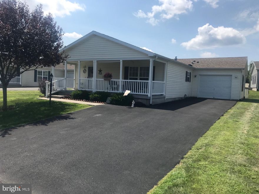 Extremely well maintained ranch in Spring Valley Village a 55 + Community located conveniently just off Route 100 in Bechtelsville. This beautiful home located in a quiet community has curb appeal.  This home has new interior paint in the main living area, kitchen, dining room and laundry room.  Newer carpet throughout and new flooring in the laundry, kitchen and dining rooms.  Enjoy your days on the covered front porch, which has plenty of space for relaxing and complete with cooling ceiling fan.   Enter the front door into the spacious living room and dining room directly off the kitchen. The kitchen offers all the modern conveniences, gas range and built-in microwave plus a breakfast bar, plenty of cabinets and a built-in pantry.  Ample size laundry room off of kitchen which includes a laundry sink and access to 1 car garage.  Garage also has pull down attic stairs for extra storage. Main bedroom includes full bath and walk-in closet.  Home also has an additional large second bedroom and full second bathroom for guests. There is a clubhouse for residents that offer many activities, large event hall with fully equipped kitchen, library, game room and meeting rooms. Community center is located within walking distance.  Welcome home!