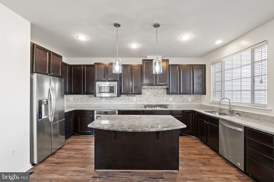 Available June 1st. Gorgeous end unit townhouse in the Colonial Forge neighborhood! Great schools!     Easy online application. 

Spacious 2,700 sqft -  3 story townhouse with 2 car garage!  Gourmet kitchen with stainless steel appliances, center island, granite countertops, gas cooking with tons of natural light and cathedral ceilings. Enjoy the new balcony deck off of the kitchen with views of fenced backyard below. Tons of space in the finished lower level - set up your home theater or could be a fantastic work out space. You will also find a full bathroom and access to the backyard and garage. Heading upstairs, you will love the huge primary suite with second private balcony deck! Perfect spot to sip your morning coffee.  Enjoy the soaking tub and separate shower in the adjoining bath. Tons of room in the walk-in closet. The laundry is upstairs for your convenience. Two more bedrooms and the guest bath finish out the spacious upper level. Fantastic location near MCB Quantico, Publix shopping center, restaurants and commuter lots going to the Pentagon and DC. Available in June Sorry, no pets. By appointment only - 24 hour notice required for awesome current Tenants, please.