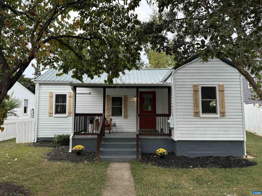 New Price! This darling Belmont cottage packs a punch! You will adore the white picket fence the surrounding the front yard, and the covered porch where you'll enjoy the view of Carter Mountain and watch baseball games right across the street at Quarry Park. The new metal roof adds to the charming exterior style and vintage flair.  Inside, the home has been completely renovated and features modern conveniences throughout.  New white shaker cabinets are found in the kitchen plus sleek stainless appliances, and a large tiled shower in the bathroom. Ductless HVAC system was added for heating and cooling. There?s even a spacious mudroom off the back with a sliding barn door. At 850 square feet, it's cozy but smartly laid out with 2 bedrooms plus an office. Just 1 mile to the Downtown Mall, minutes to UVA, and around the corner from I64, it's a great location! If you're looking for an affordable, low-maintenance, move-in ready home in a fantastic location, this one's got the charm and the updates to match. Don't miss this opportunity to see this one before its gone!,White Cabinets