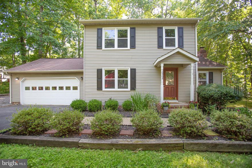 This charming, 2-story colonial is surrounded by wooded greenery, offering you peace and privacy in a park-like setting! The spacious kitchen with peninsula counter offers an open view into the family room with vaulted ceiling and a cozy, wood-burning fireplace which goes perfectly with a cup of cocoa. On crisp and warm days alike, sip your morning coffee or afternoon lemonade in comfort out on the spacious rear deck which overlooks a serene backdrop of beautiful, mature trees. The sprawling backyard offers an abundance of barbeque, play, or gathering space. It's the perfect retreat for some alone time, pets, or for entertaining family and friends! Your separate formal dining room and living room off of the kitchen offer plenty of room for additional dining and interior gathering. Hardwood & tile flooring throughout the main level make cleaning up a breeze with just a sweep or a wipe! Upstairs, you'll find two secondary bedrooms and a spacious master suite with an en-suite, full bathroom, ideal for peaceful slumber after a day at the community playground or pool. Before you head off to work, don't forget to grab that steak from the extra mini-freezer to defrost for dinner! Come home to the Holleybrooke Subdivision, a friendly neighborhood rife with cul-de-sacs amidst a canopy of trees perfect for a leisurely walk or bike ride away from the main roads. Shopping, Dining, I-95 and Rte 1 are all just a short commute away!