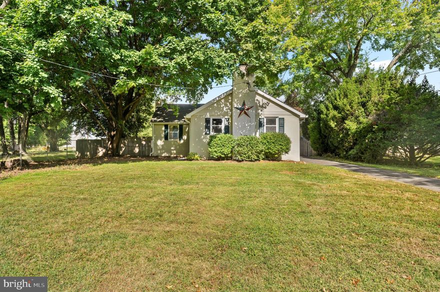 Looking for privacy and space to spread out?  A garage tailor-made for the car-enthusiast with an oversized-door and height for a lift?  An open floor plan great for entertaining?  This sunny home has it all!  Enter from the appealing deck in the rear of the home, a peaceful place to look over your level and fenced land.  The living room is highlighted by a stone fireplace with wood pellet stove insert and flows into the dining room and renovated kitchen.  You'll enjoy the massive leathered granite counters, spacious breakfast bar, and abundant cabinetry.  The two bedrooms are nicely-sized with ceiling fans and multiple windows.  Plus, you'll find a room ideal for a home office, library or play room.  The hall bath, linen and coat closets complete this level.  Head down to the unfinished basement with bilco doors for more living and storage areas, and laundry.  Outside, the detached garage is just what you've been searching for.  Fully remodeled in 2010, it measures approximately 30’ x 24’ and features a 12’ x 12’ door, perfect for large vehicles and trailers, with ample room for a lift or conversion into a workshop or other multi-use space.  An open ceiling floor plan was created with extensive fluorescent and recessed lighting, new insulation and concrete flooring, NewAge enclosed cabinet and work storage system, and additional workbenches.  You’ll appreciate the wood pellet stove for heat and a 100-amp electrical service, ceiling fan and attic fan.  There’s direct access to a glass-enclosed party room, ready for kicking back at the end of the day, or gather around the fire pit just outside.  With central air, a newer roof (2019), generous shed, plenty of parking, and all the opportunities to design the lifestyle you want, this is the home you've been waiting for!