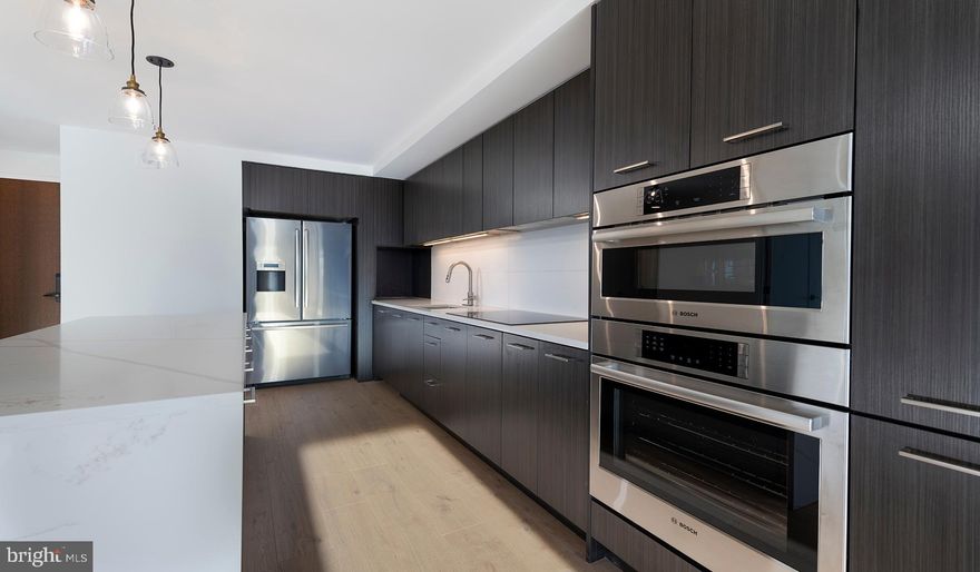 Experience the Pinnacle of Urban Living at The Elm, Bethesda

Nestled in the vibrant heart of Bethesda, adjacent to the bustling Bethesda Row, The Elm presents an exquisite blend of modern living and environmental consciousness, certified by its prestigious Gold LEED status. Our diverse range of homes, including studio, 1-, 2-, and 3-bedroom options, are meticulously designed with contemporary finishes, state-of-the-art stainless steel appliances, and an unparalleled location in the center of Bethesda.

Elevate Your Lifestyle with Exceptional Amenities. At The Elm, indulgence meets convenience. Soar to new heights of relaxation at our 28th-floor rooftop pool or embrace wellness at our modern fitness center. The 17th-floor landscaped terrace offers a serene escape, while our expansive Skybridge on the 28th floor provides a unique vantage point. Our community spaces, including lounge areas and workspaces, cater to your every need, mere steps from a plethora of dining and retail options.

Discover Unparalleled Living Spaces. Our homes and penthouses boast double-height ceilings, bathing each space in natural light. Revel in the luxury of walk-in closets and modern kitchens equipped with Bosch and Samsung appliances. Select homes further enhance your living experience with private balconies and patios.

Immerse Yourself in the Cultural Hub of Bethesda Row. Reside in the epicenter of culture, dining, arts, and entertainment. The Elm is a stone's throw away from Woodmont Triangle, a vibrant nexus of cultural activities and community events. Enjoy an array of outdoor concerts, art festivals, and farmer's markets that animate the neighborhood year-round.

Redefine Relaxation and Productivity. Our rooftop pool is not just a swimming facility; it's an oasis of tranquility with resort-style seating and stunning panoramic views. The Elm's numerous spaces are designed for your relaxation, health, and convenience, offering a myriad of ways to unwind and rejuvenate.

Your Personal Sanctuary and Community Awaits. Whether you're immersing yourself in a captivating novel or engaging in meaningful conversations, The Elm offers the perfect backdrop. Our curated fitness studio caters to health enthusiasts with a convenient and inspiring workout environment. The 28th-floor Skybridge is an ideal spot for hosting events or enjoying private gatherings, all while being surrounded by breathtaking views.

Schedule Your Personalized Tour Today. We are dedicated to providing an exceptional living experience. Contact us to schedule a tour tailored to your preferences. The Elm is proud to be a smoke-free and pet-friendly community. Welcome to a new standard of living, where every detail is crafted for your comfort and convenience.

** Pricing and availability subject to change on a daily basis ** Photos are of model units ** Parking may be available for an additional fee **