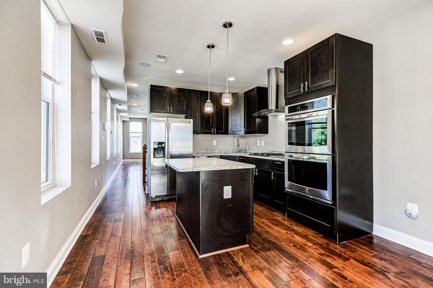 If you’re looking for a unique and lovely space in the heart of Canton, this Unicorn Listing Rental might be your perfect home! This 3-bedroom, 3.5-bathroom corner home offers plenty of natural light, a blend of open-concept space with bedrooms that offer plenty of privacy, and a rooftop patio that boasts of a 360-degree view of the neighborhood!

The main living space features hardwood floors throughout and ample space to entertain both in the living room and open chef’s kitchen. The kitchen itself features granite countertops, a double-mounted oven and microwave, a kitchen island with a breakfast bar, and space to accommodate a table for more formal dining. The dining area of the kitchen opens up to a second-floor patio for additional entertaining space or simply to have a quiet cup of coffee or a glass of wine in relative tranquility.

 The rooftop provides unparalleled views of the city and fireworks.  It's also equipped with an indoor and outdoor speaker system ( receiver not provided) and LED lighting. The primary bedroom provides a double-door ensuite bathroom, and the remaining bedrooms both come with ample storage. A video intercom system allows for easy communication throughout the house, with multiple portals throughout for greater accessibility.

This home’s convenient location leaves you within blocks of local shops and restaurants, the 1.5-mile trail around the Inner Harbor, and iconic Patterson Park. You are also near other beloved Baltimore neighborhoods like Fells Point and Little Italy! You’re also only about two miles from I-95 for any potential commutes you may have. 

Make this charming rental yours, and you will feel at home right away.