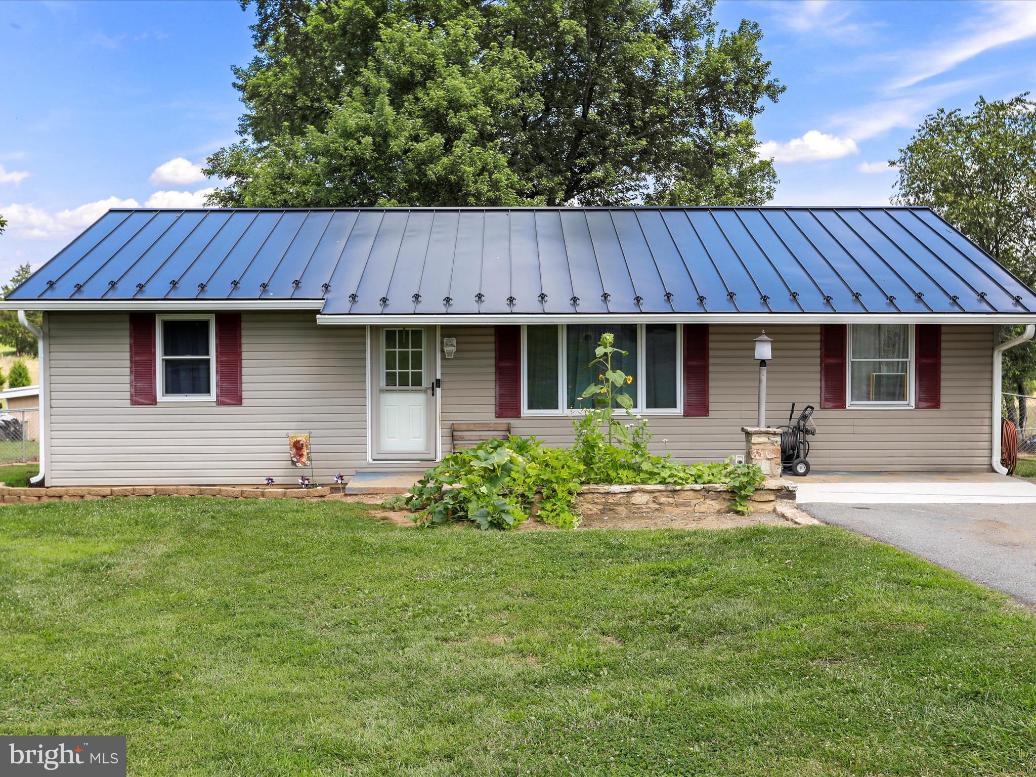 Unresticted, mostly level 1.98 acres in Clear Spring! Enjoy one level living with this updated 3 bedroom, 1 bath, ranch style home! The kitchen has quartz countertops and SS appliances! Bonus mudroom is an excellent tie between the home and outdoors! A two year old black metal roof perfectly compliments this home! Gutters, well pump and pressure tank are also just two years old! Enjoy crisp water with a newer RO system as well! The rear of the home is fenced (but yard goes beyond.) 2 sheds with a lien to offer plenty of outdoor storage space! HVAC system was installed in 2019 and a new deck was just completed in July 2025! Rocky Meadow is located at a dead end, so traffic is very minimal!