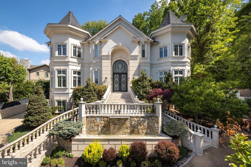 Exceptional in both scale and execution, this custom-built European inspired Villa offers a level of craftsmanship and material quality rarely seen in the market. Thoughtfully updated in 2024, the home stands well above typical new construction, blending architectural drama with refined, enduring finishes.

A grand 26-foot double-height foyer introduces the home with a striking 16-foot custom cast iron entry door, setting the tone for interiors defined by volume, light, and precision. Soaring 12-foot ceilings, expansive windows, and a seamless flow create a sense of openness throughout, while full marble flooring across the main and upper levels adds a level of continuity and sophistication seldom achieved.

At the center of the home, a sculptural curved marble staircase with custom metal railing serves as a true design focal point. The chef’s kitchen is equally impressive, appointed with furniture-grade cabinetry, a premium Dacor appliance suite, double dishwashers, and a warming drawer, designed for both elevated everyday living and effortless entertaining.

Additional highlights include solid wood millwork, 8-foot solid core doors, a private office with custom built-ins, and Pella Architectural Series windows and doors with retractable screens, seamlessly integrating indoor and outdoor living.

The fully finished lower level offers a distinct extension of the home’s lifestyle appeal, featuring a custom bar, private theater room, and generous ceiling height, ideal for entertaining or retreat.

Outside, the property delivers a true sense of arrival and privacy, with a curved entry staircase, illuminated water features, professionally designed landscaping, and a resort-style backyard anchored by stone waterfalls. A custom stone driveway, automated entry gate, and oversized three-car garage complete the offering.

A rare opportunity to own a home where design, scale, and craftsmanship converge at an uncompromising level.