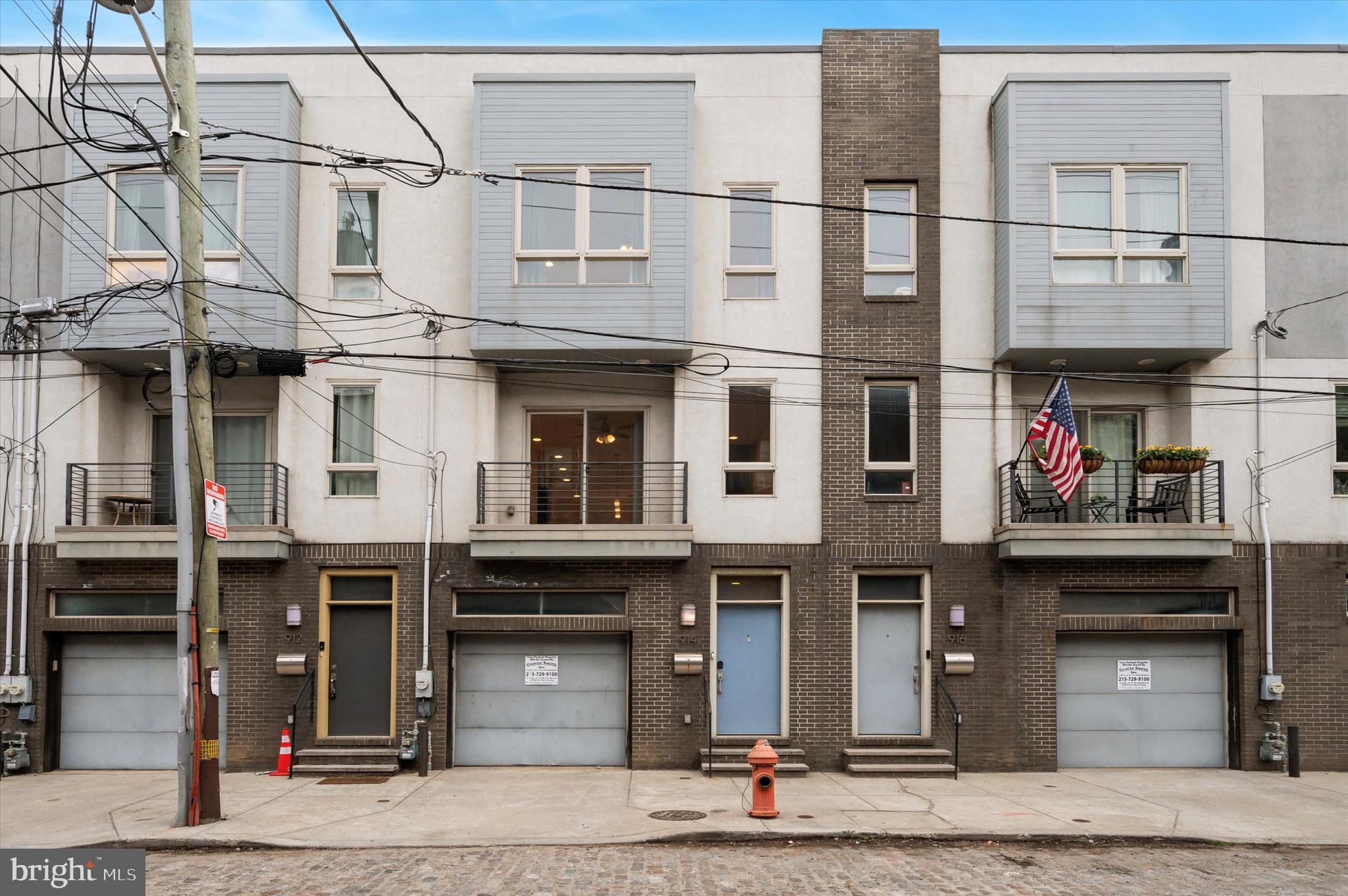 A townhome with PARKING in Northern Liberties under $575k? Say less! Welcome to 914 N Front Street, a 3 BD/3 BA row home that ticks all the boxes. From multiple outdoor spaces and an expansive main floor to a private garage and tasteful interior finishes, this home is fit for someone looking for first-class living in the heart of Northern Liberties. After a day's work, pull into your garage and enter through the interior door. Kick off your shoes and hang your coat in the dedicated entryway closet, then take the stairs up to the main level. The first floor boasts an open living/dining area connected by a gourmet kitchen, which features espresso cabinets, a mosaic tile backsplash, pendant lighting, stainless steel appliances, and an island for additional seating/dining/counter space! In the warmer months, slide open the front or rear glass doors for a warm cross-breeze. The rear deck fits a BBQ, making hosting or meal prep easy peasy. Ascend to the next floor, which is home to a laundry closet, two well proportioned bedrooms, and a hall bath. The upper floor is the owner's suite, complete with its own en-suite bathroom and closet spaces. The basement is bone-dry and finished; ideal for additional lounge space, home office, or a home gym. Bamboo flooring throughout. Central AC. Steps from Jerry's Bar, Bourbon and Branch, The Kettle Black, Pietramala, and CNT Cafe. Minutes from the Market-Frankford Line, I-76, I-95, and the Philadelphia International Airport.Offering 1% interest rate BUY DOWN for one year at ZERO cost to buyer when buyer uses homeowner's preferred lender.