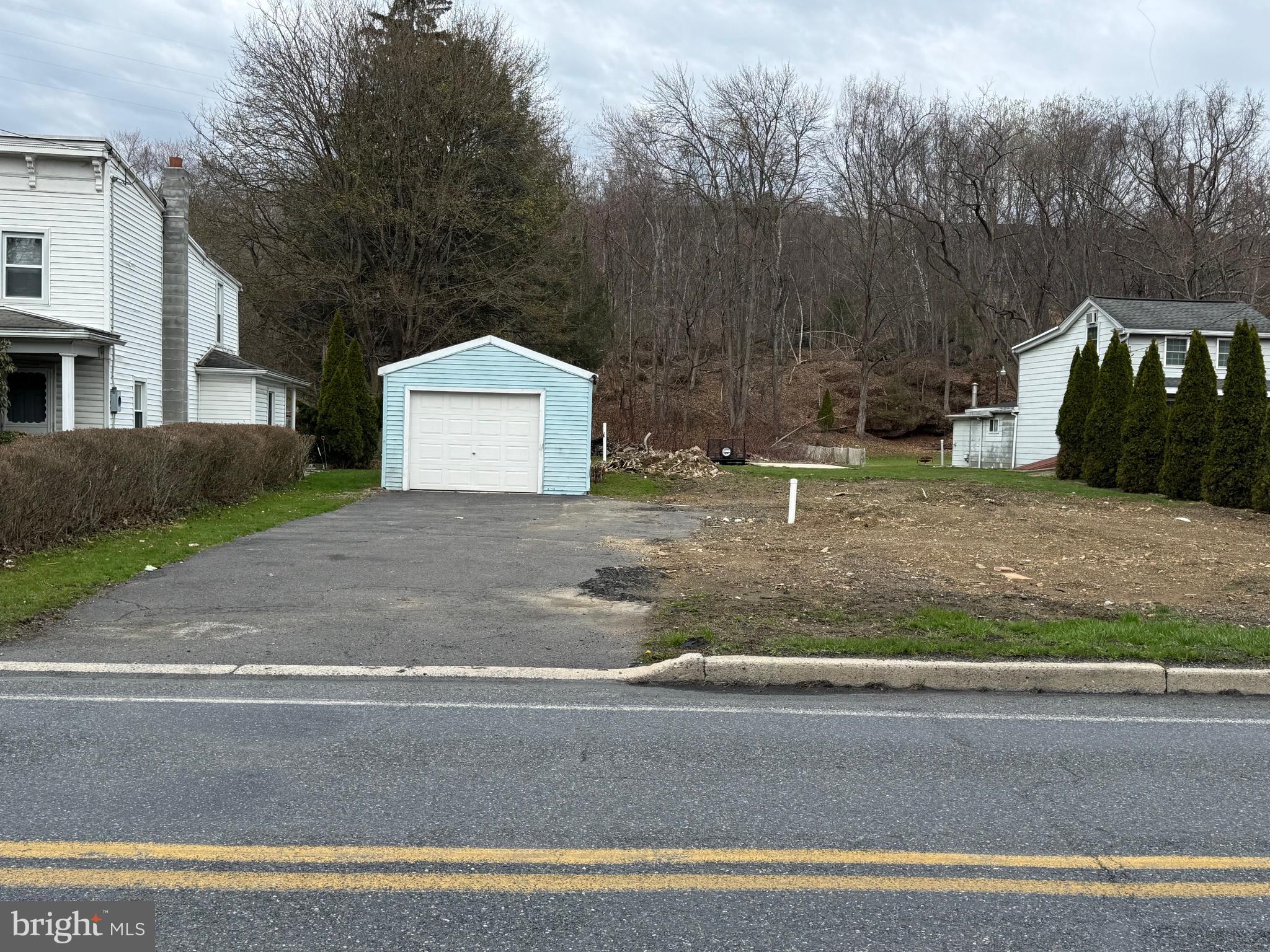Adventure-Ready Land with Utility Access – Ride Straight into Famous Reading Outdoors!
This level lot is the ultimate base camp for year-round living or weekend getaways. With full access to utilities and direct access to the renowned Famous Reading Outdoors park, it's perfect for those looking to place a mobile home or create the ultimate off-roading retreat. Backed right up to woods with over 650 miles of trails, you can ride directly from your backyard onto one of the most celebrated off-roading systems in the region. Whether you’re into ATVs, dirt bikes, UTVs, or four-wheeling, you’ll find endless miles of trails that wind through scenic mountaintops, historic coal lands, ghost towns, and open meadows. It's a true haven for off-road adventurers of all skill levels.
The existing garage can fit one car or several large quads and there is a 19' x 12' concrete pad ready for an additional shed or outbuilding. There is plenty of space to park multiple campers or bring in a mobile or modular home of your choice. And this plot is only a few miles away from Highridge Industrial Park, which includes a major travel plaza, making it an easy commute for those employed there.
Whether you're looking for a peaceful escape with mountain views or a hub for adrenaline-packed weekends, this property delivers the best of both worlds! Don’t miss out on this rare opportunity with unbeatable trail access and year-round adventure right at your doorstep.