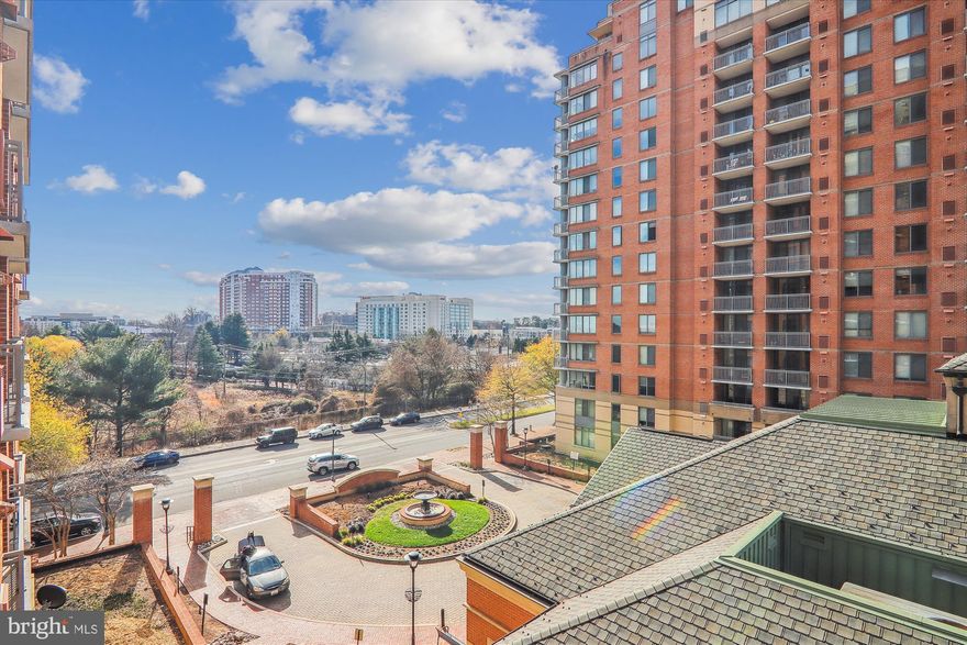 Gorgeous, luxury gated condo for an affordable price in The Gallery - 
Feel like royalty as you enter this luxury building and take the elevator up to apartment 507. This updated 1-bedroom, 1-full bath condo has an open floorplan of spacious 796 square feet. Large windows allow for sun to stream in filling every room. Beautifully cared-for gleaming engineered hardwood floors and ceramic tile kitchen and bath floors. You will love the granite counters with coordinating designer backsplash, new stainless steel microwave and brand new gas stove. New lighting in kitchen and bathroom. Large step-in shower with grab bars and new glass shower doors. And more. The new recirculating water heater lowers your costs. The bedroom has a large closet. Stacked full-size washer and dryer are conveniently located inside the condo. Newly painted and professionally cleaned throughout. Private balcony. Covered garage parking #130 included. Pet-friendly building.

With low condo fee of $350/month, residents love The Gallery. This professionally managed building features 24-hour concierge, clubhouse, meeting rooms, exercise and fitness center, movie theater and outdoor pool. Even a market that owners get to from inside the building with their fob! Community room has its own kitchen! Convenient location is close to METRO, shopping, restaurants, entertainment, and highways. Routes 495, 270, 355 nearby. Exciting new Pike and Rose, with its weekly Farmers Market, is just across the street! Easy to do your shopping at Harris Teeter and Whole Foods.